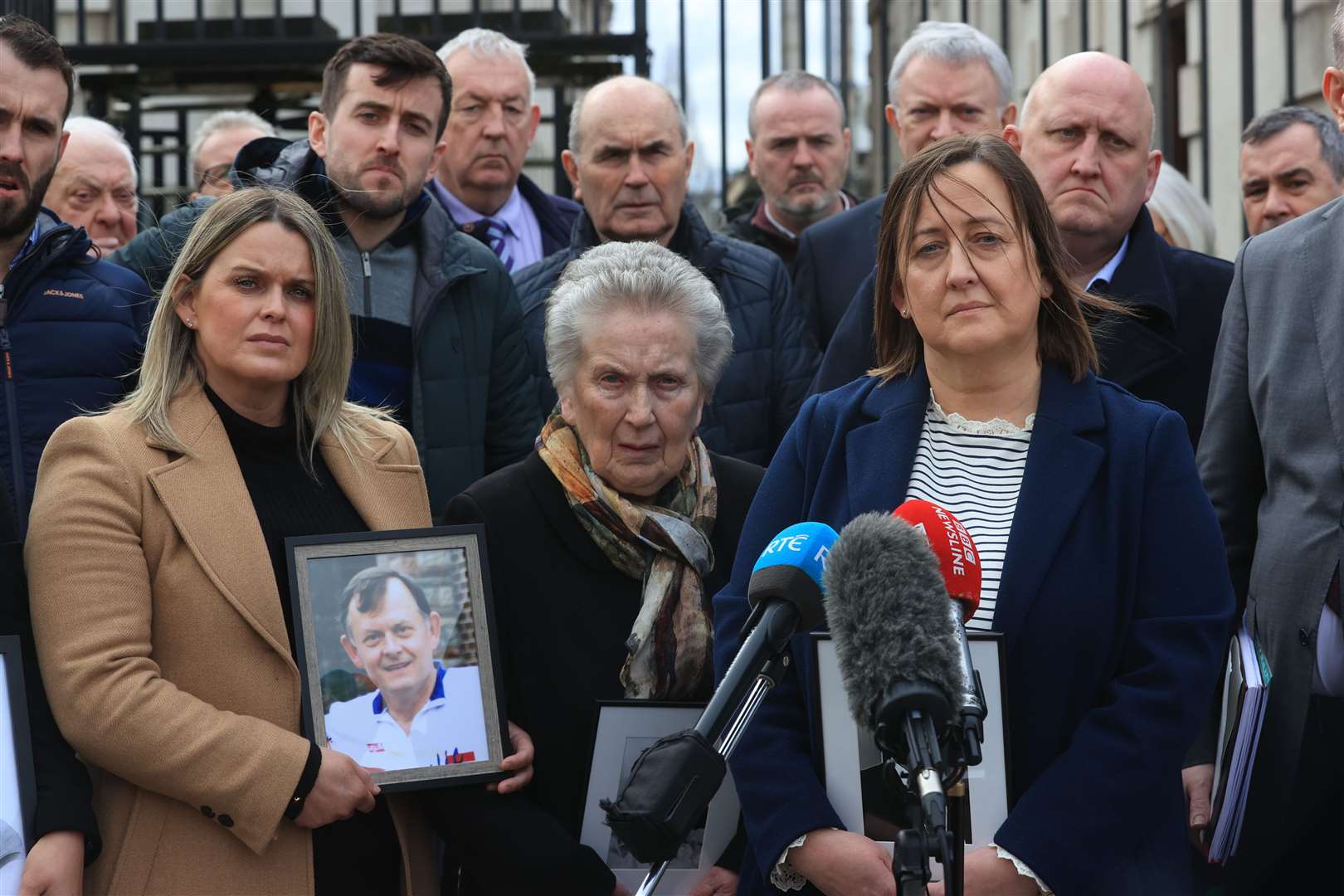 Bridie Brown, the wife of Sean Brown, with his daughters Claire Loughran (left) and Siobhan Brown (front right) and his son Sean Brown (rear right) speaking to the media outside the Royal Courts of Justice, Belfast in March (PA)