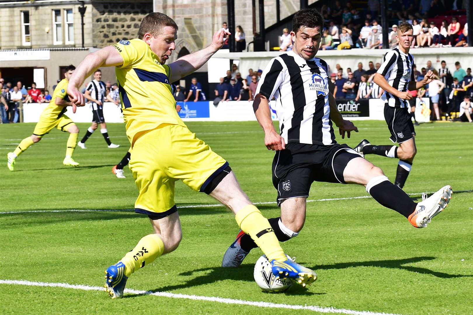 Davie Allan tries to get the better of Fraserburgh's Willie West during a Highland League clash at Bellslea Park in 2019. Picture: Mel Roger