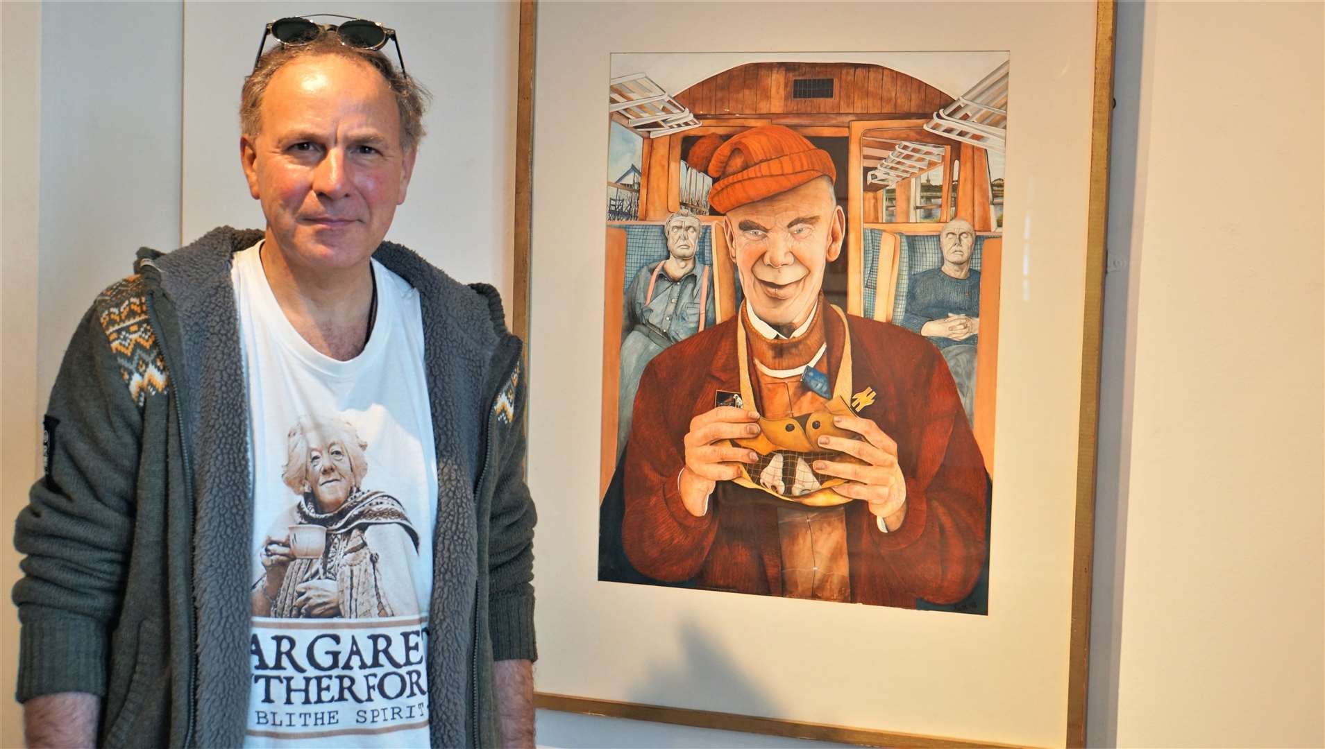 Ian with one of his paintings that featured in St Fergus Gallery's last exhibition before it closed. Picture: DGS