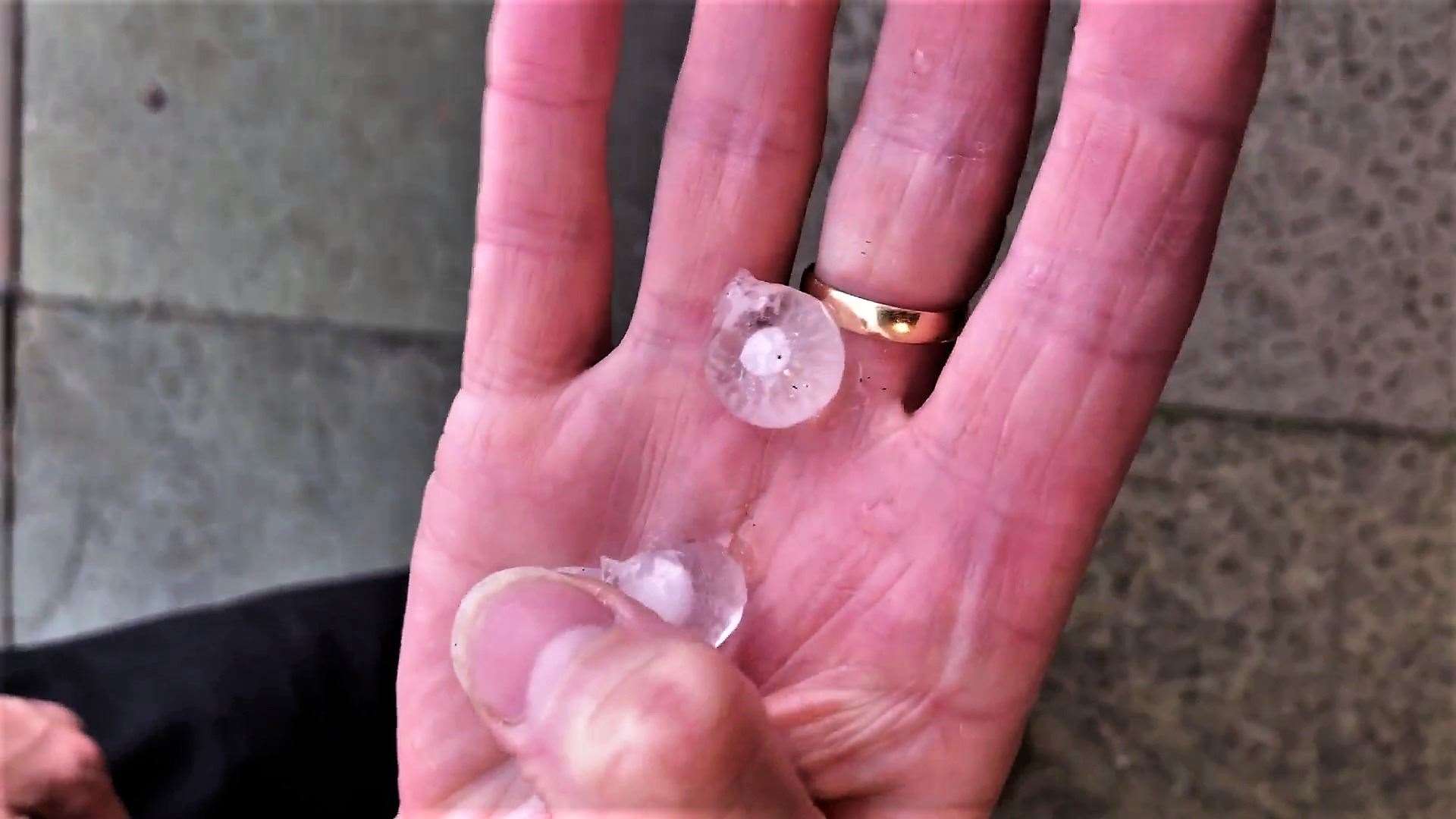 Video frame grab from footage captured by Neil Buchan. There is a core in each hailstone that is surrounded by ice.