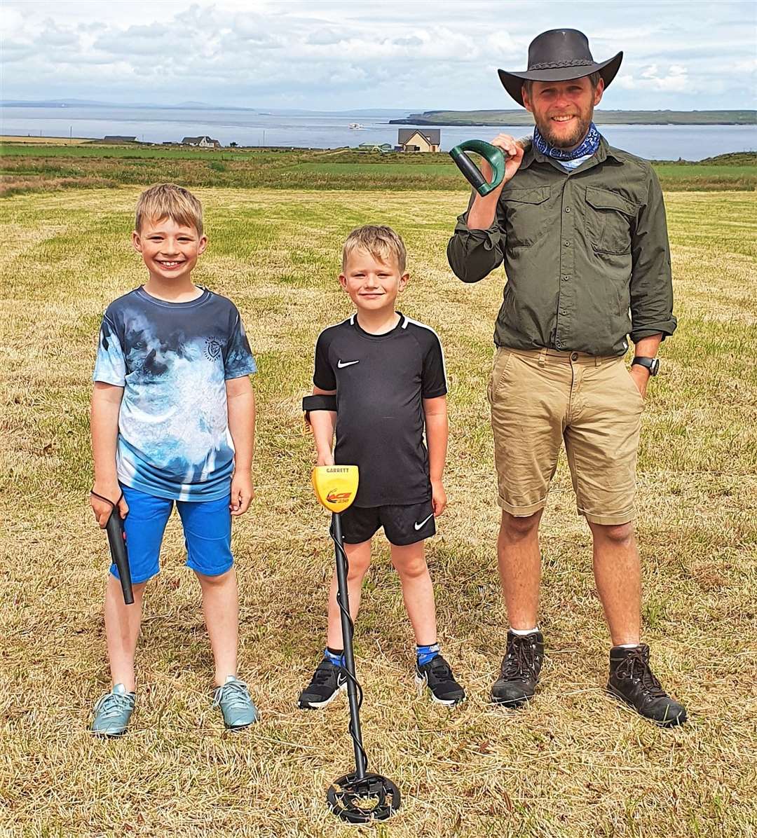 Chris Aitken out metal detecting with with his sons Callum, right, and Finlay.