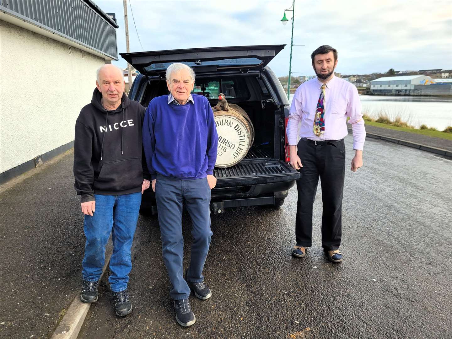 From left, John Paterson, Gus Mackay (who helped cut the barrel planters) and community advocate Alexander Glasgow outside the Royal British Legion branch in Thurso. Picture supplied