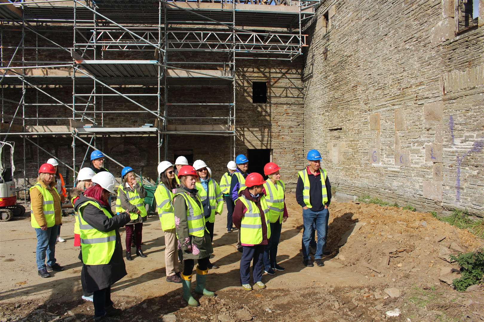The group looks on as work on the mill site is shared. Picture: John Davidson