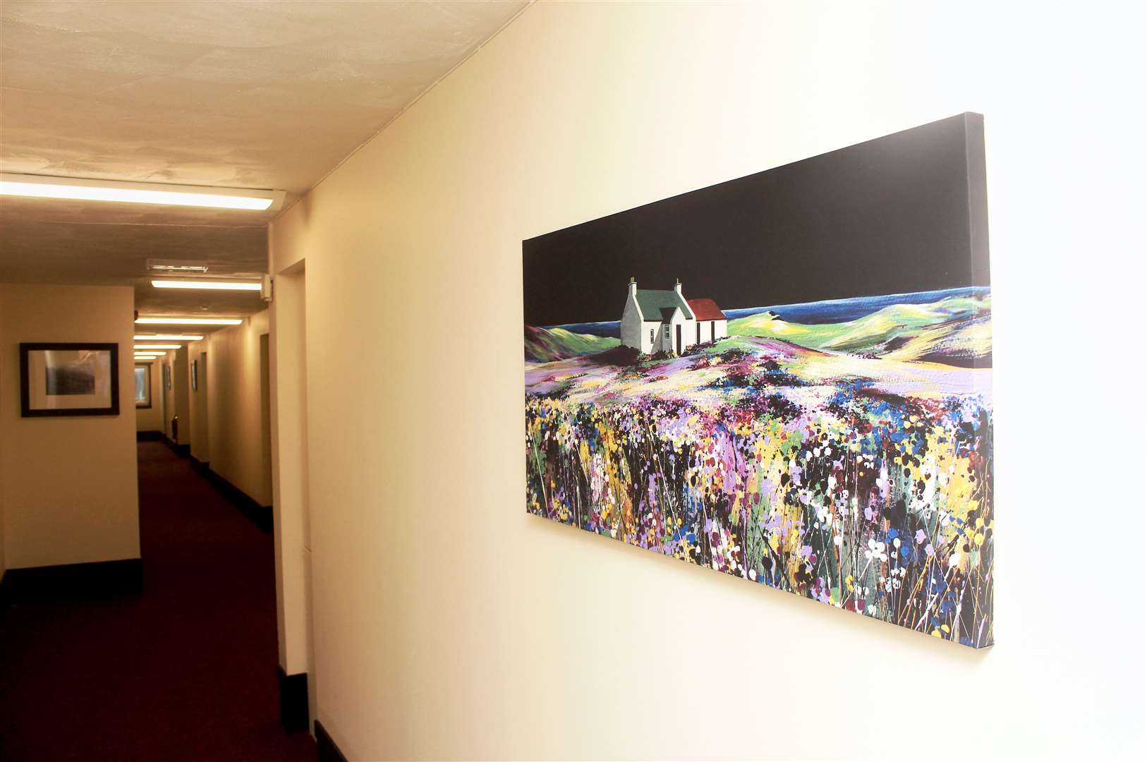 Prints line the walls on the first floor of Wick Bay Apartments.