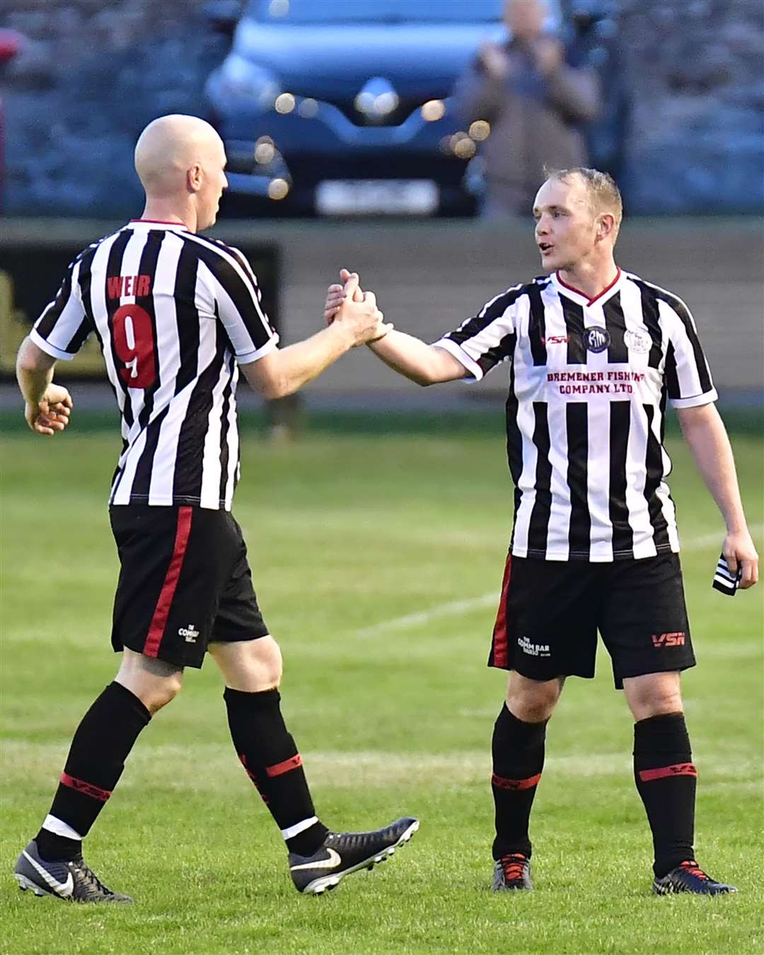 Gary Weir congratulates Richard Macadie as he leaves the pitch. Picture: Bob Roger