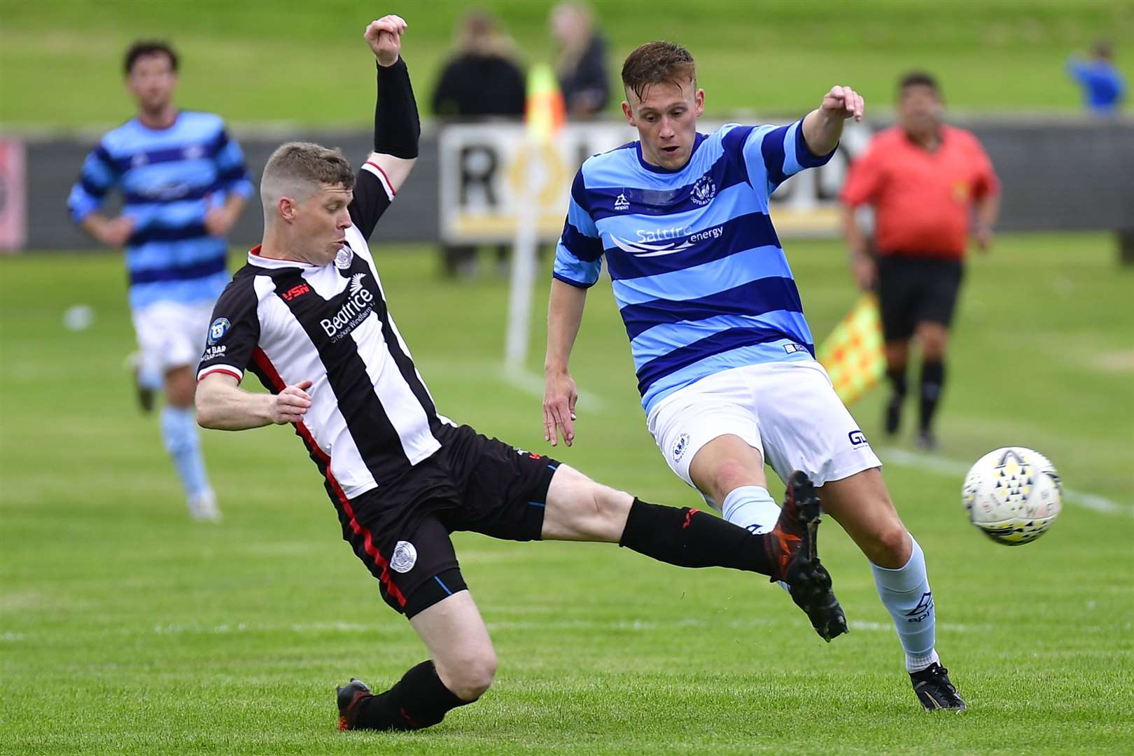 Wick Academy's Ross Allan challenges Lachie Macleod of Banks O' Dee. Picture: Mel Roger