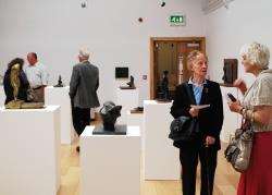 Visitors admire the work displayed at the Ann Henderson Exhibition