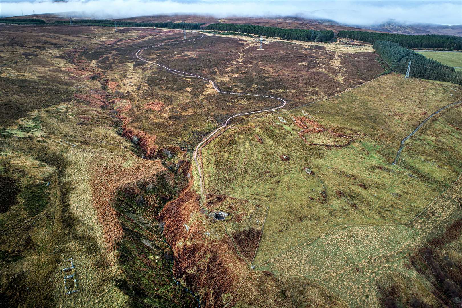 Nestled at the foot of two streams, Allt A'Bhurg and Ousdale Burn, the broch occupies a commanding position. To the upper right can be seen evidence of Borg, a post-medieval clearance village, which took its name from the broch. Borg is Old Norse for 'fort', which is where the word 'broch' is derived. Picture: Angus Mackay