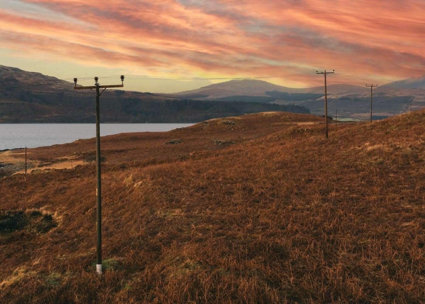 Wooden poles and overhead lines will be among the renewal and upgrade works undertaken. Picture: SSEN Distribution