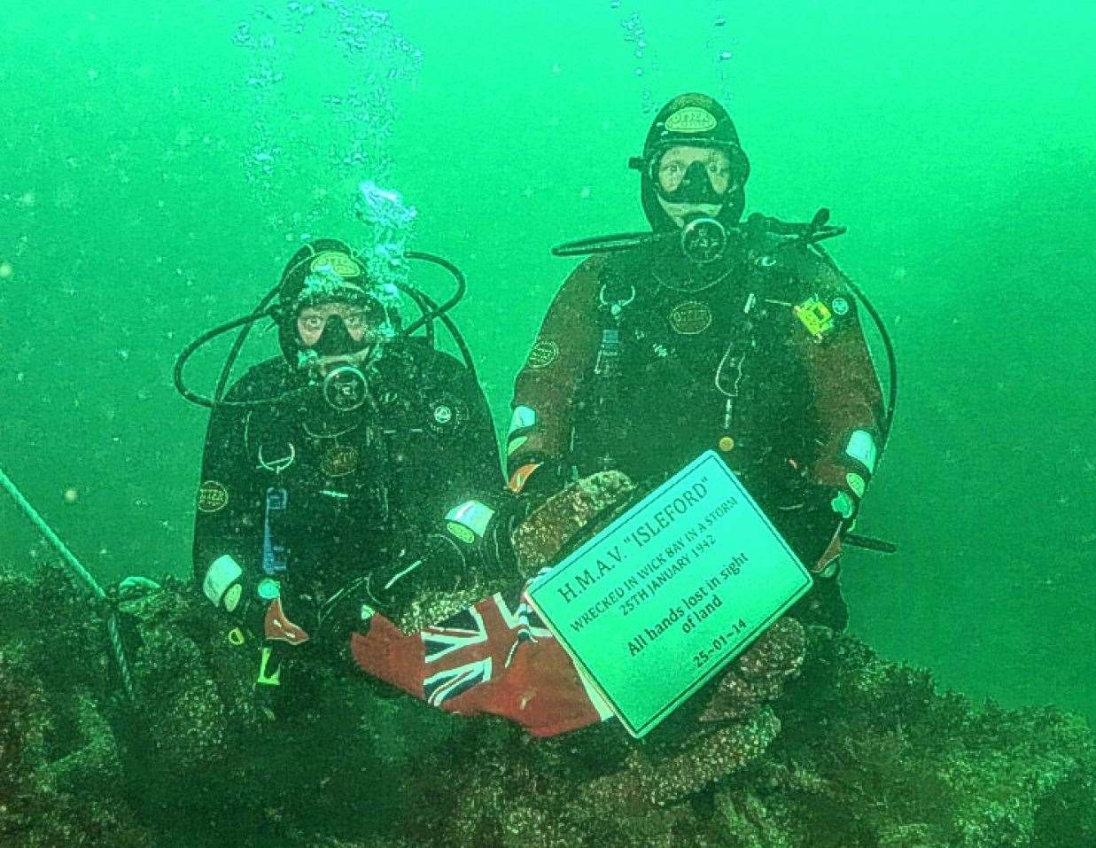 Divers Mark Cormack and Neil Pellow attaching a memorial plaque to the wreck of the Isleford in Wick Bay in 2014. Picture: Martin Gill