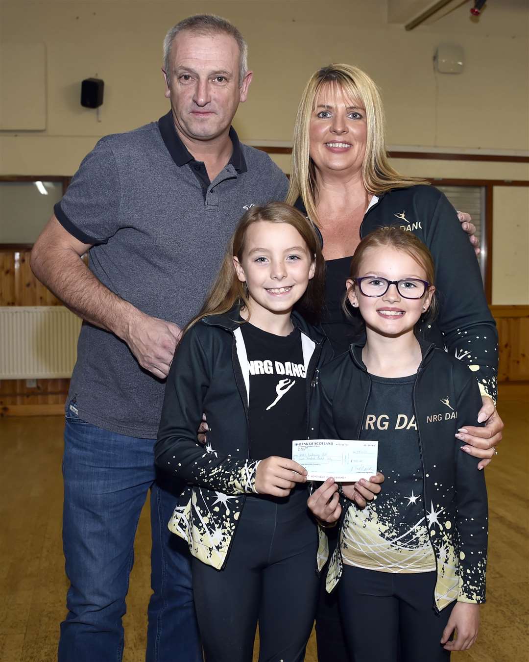 Tracy Sinclair and girls from NRG Dance receiving their cheque from Allan Smith. Picture: Mel Roger