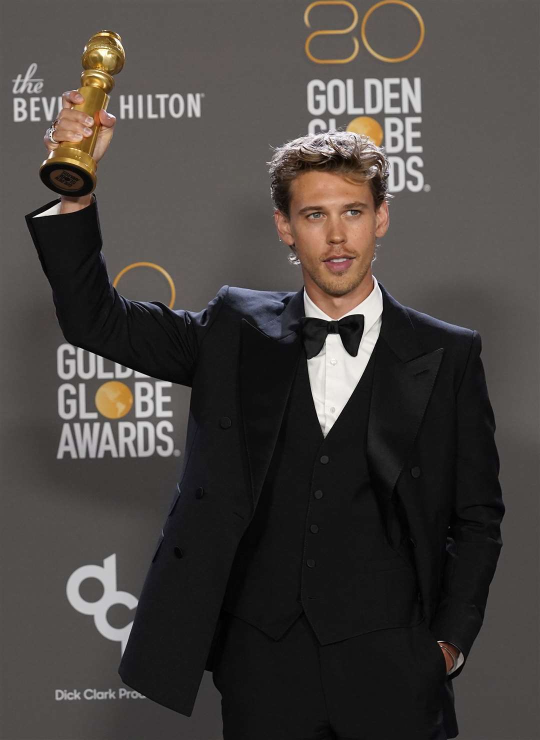 Austin Butler poses in the press room with the award for best performance by an actor in a motion picture: drama for Elvis (Chris Pizzello/Invision/AP/PA)
