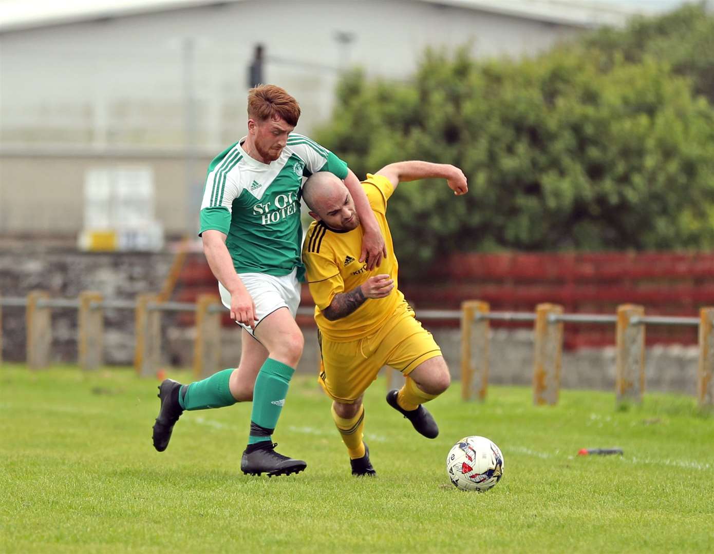 Kirkwall Thorfinn's Jack Stout gets to grips with Martin Banks of Staxigoe in the last round. Picture: James Gunn