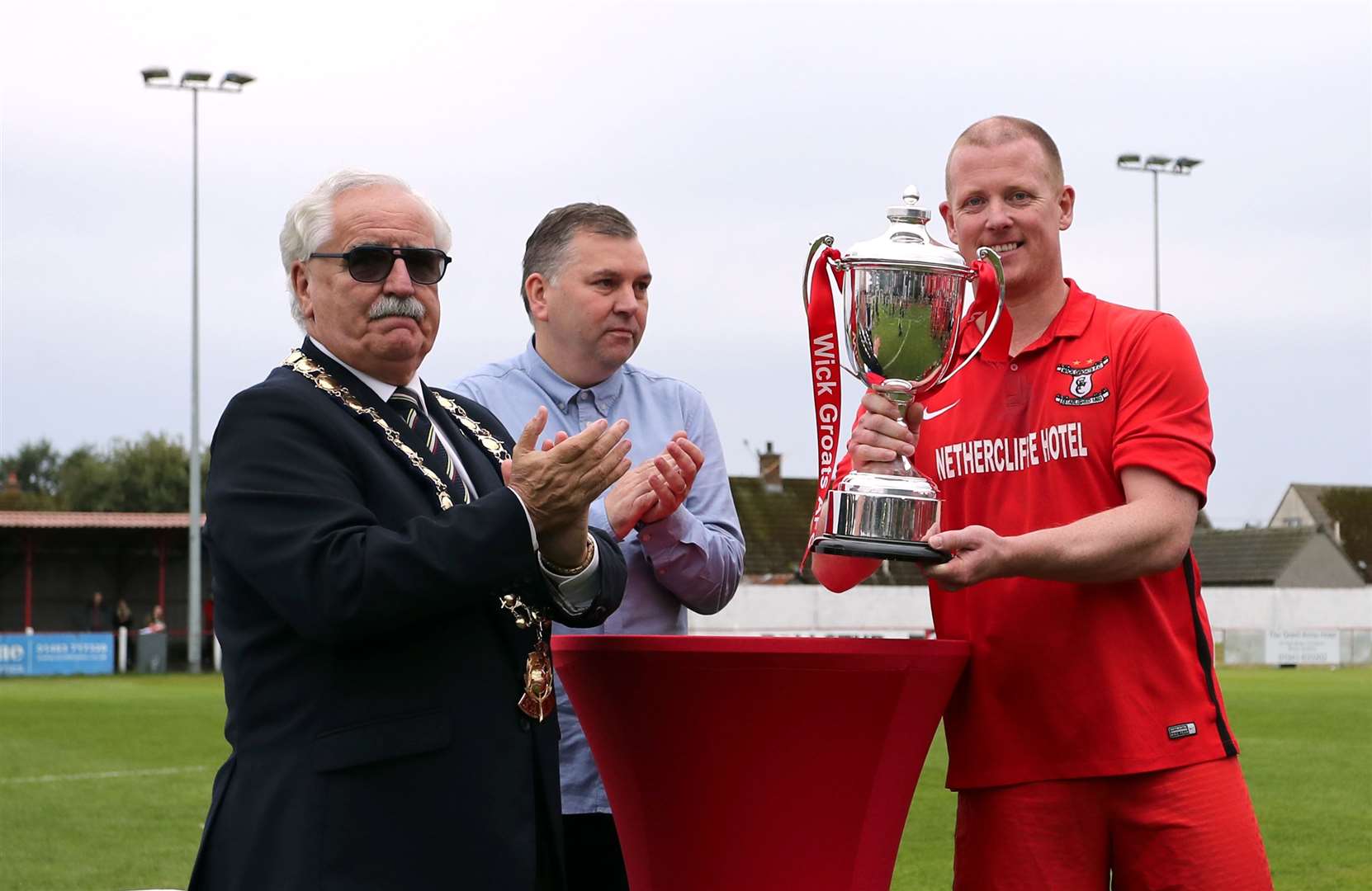 Alan Sinclair receiving the Highland Amateur Cup in 2019 after Wick Groats' victory over Avoch in the final at Brora. It was the fourth time in seven years that the trophy had gone to Groats. Picture: James Gunn