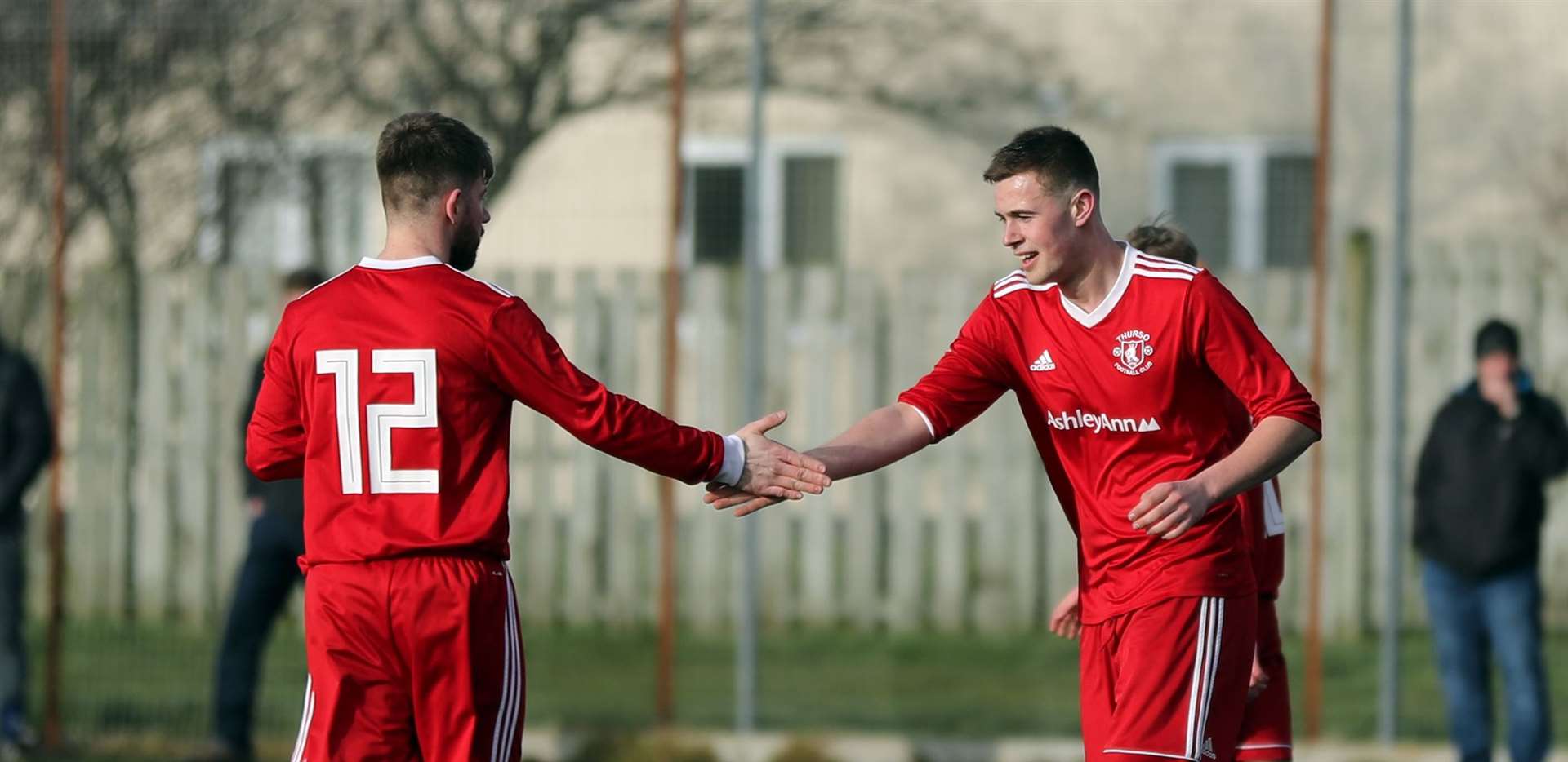 Michael Petrie (left) congratulates Conor Trueman on scoring for Thurso in the runaway win against Bonar. Picture: James Gunn