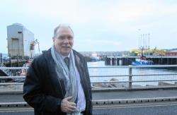 Rob Gibson MSP at Scrabster with Scotrenewables’ prototype tidal turbine on the new quay.