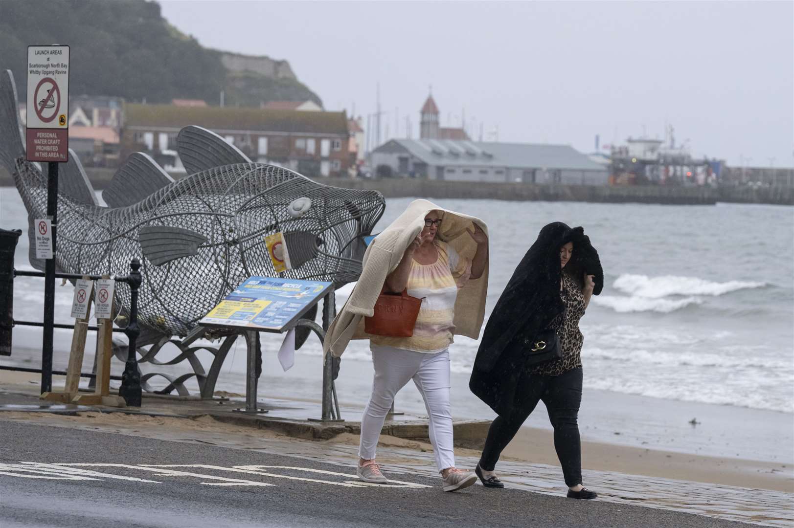 People walk along the seafront in Scarborough, North Yorkshire (Danny Lawson/PA)