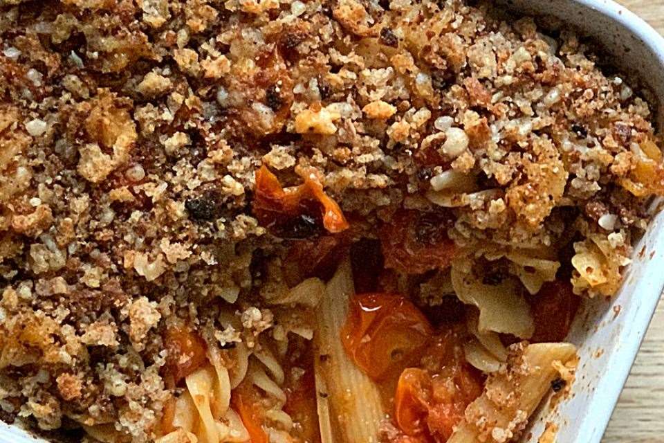 Cherry tomato pasta bake with sourdough and parmesan cheese.