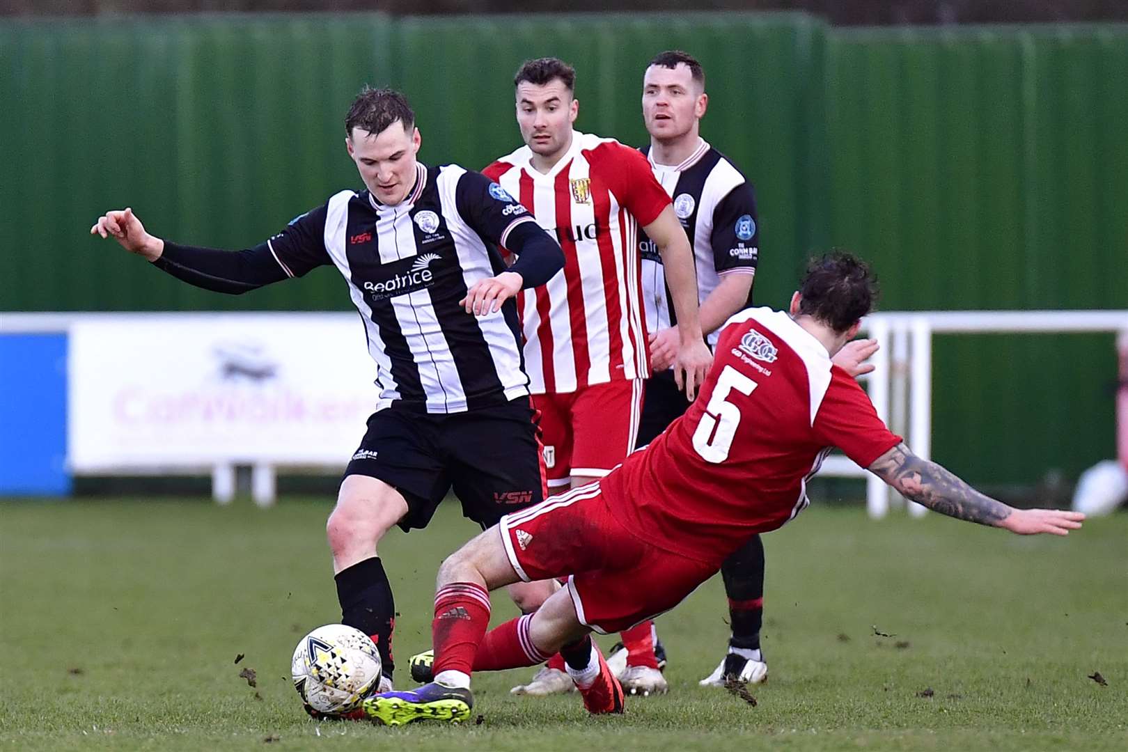 Wick striker Steven Anderson is challenged by Formartine United's Aaron Norris. Picture: Mel Roger