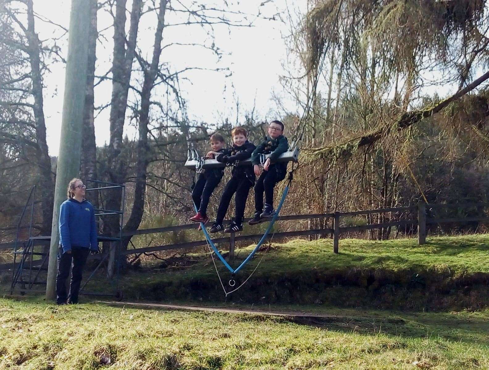 Rhys McBeath, Shay Macdonald and Owen Harding trying out the giant swing.