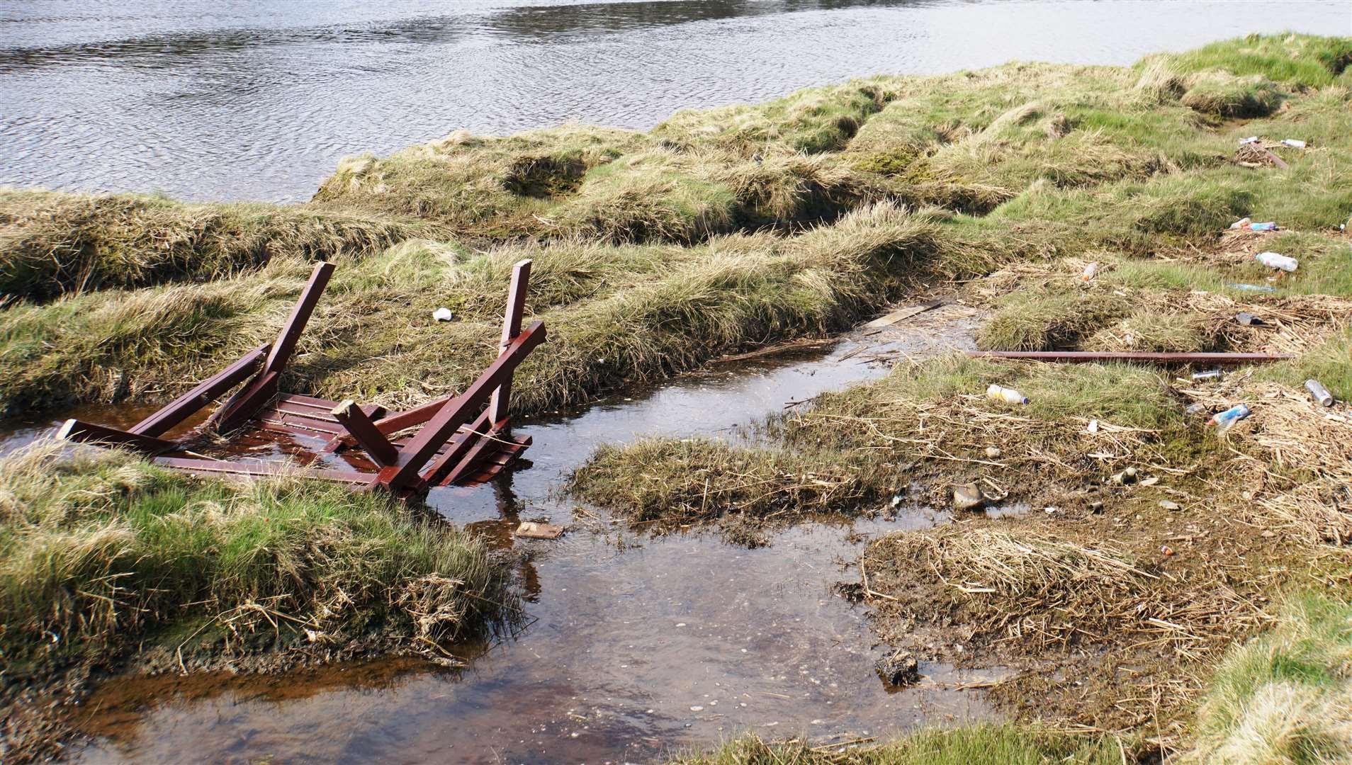 A picnic bench smashed up and thrown in Wick River last April