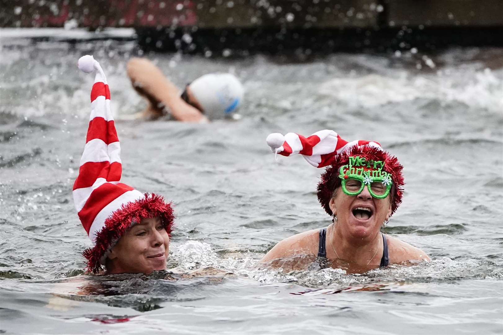 People dressed up for the swim in London’s Hyde Park (Aaron Chown/PA)