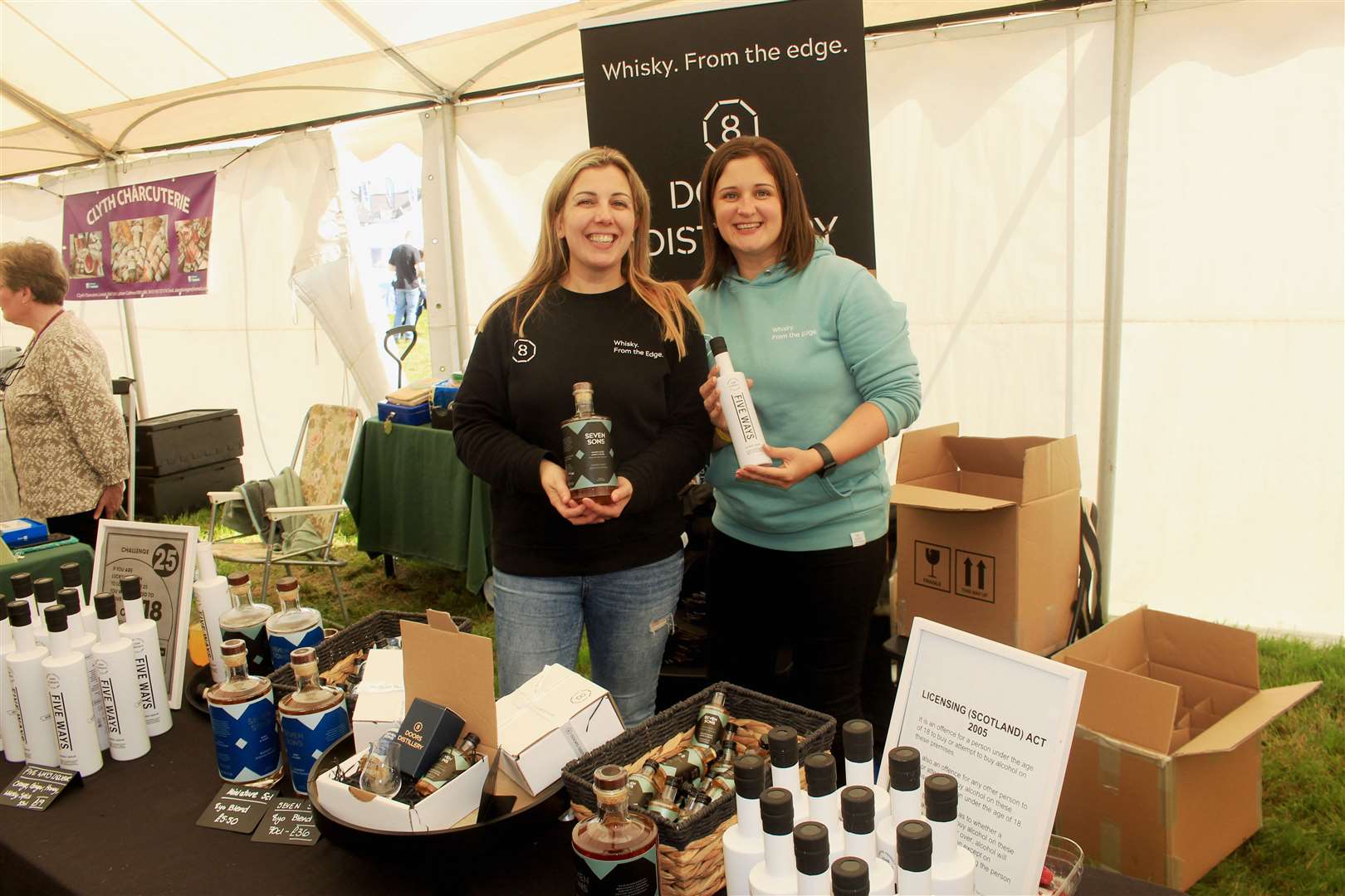 Kerry Campbell and Laura MacDonald at the 8 Doors Distillery stand in the Northern Quality Produce marquee. Picture: Alan Hendry