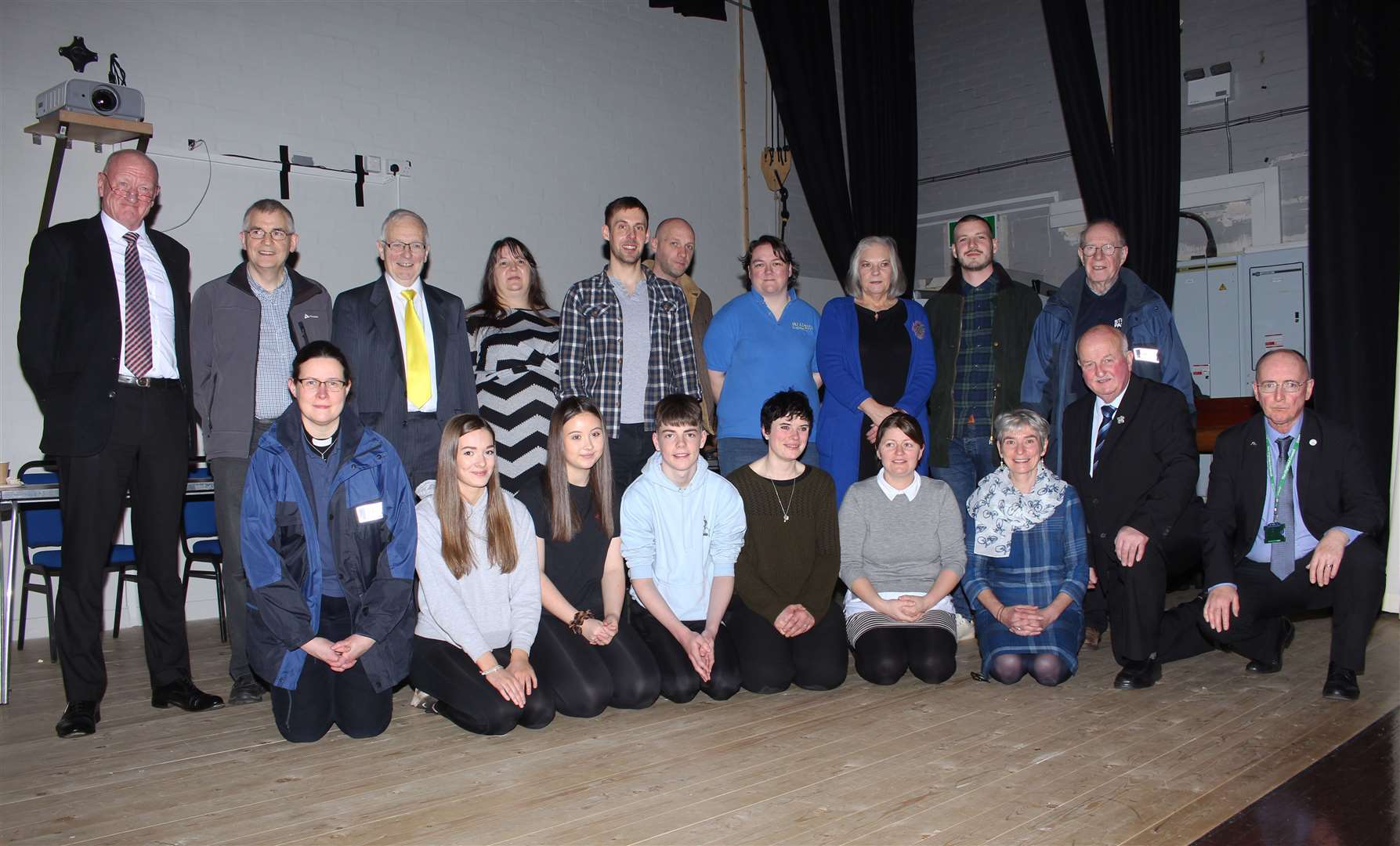 Winners in the sixth Your Cash Your Caithness on the stage at Thurso High School after Saturday's event, with the compere, civic leader Willie Mackay (kneeling, second from right), and Highland Council's Caithness ward manager Alex Macmanus (right). Picture: Alan Hendry