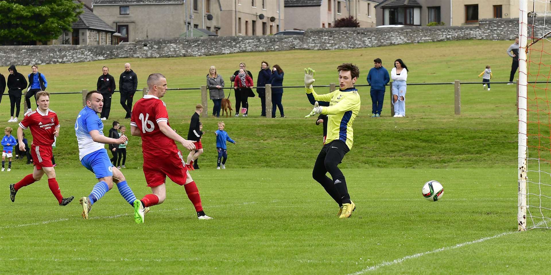 Owen Harrold slots ball past Wick Groats keeper Kieran Macleod to equalise for Wick Thistle. Picture: Mel Roger