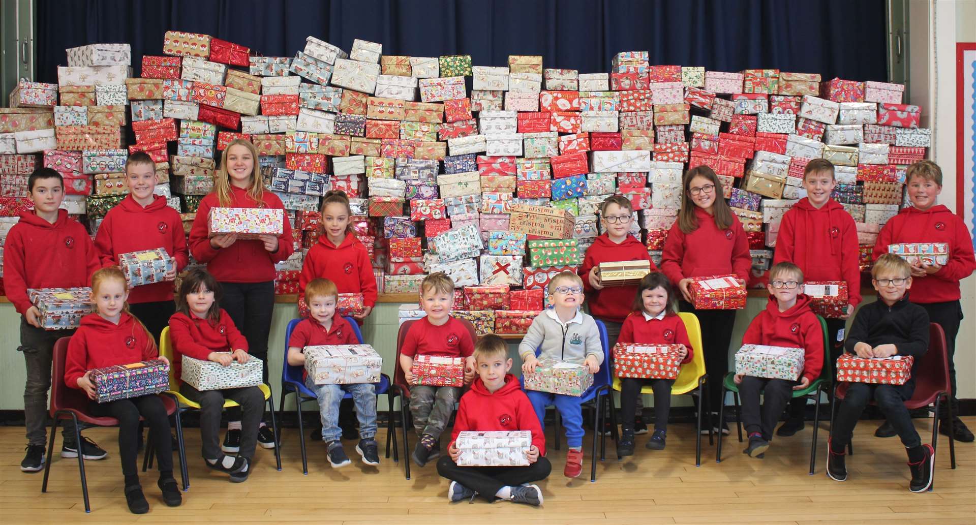 Children line up with the Blythswood shoeboxes in Castletown. Picture: Ann Manson