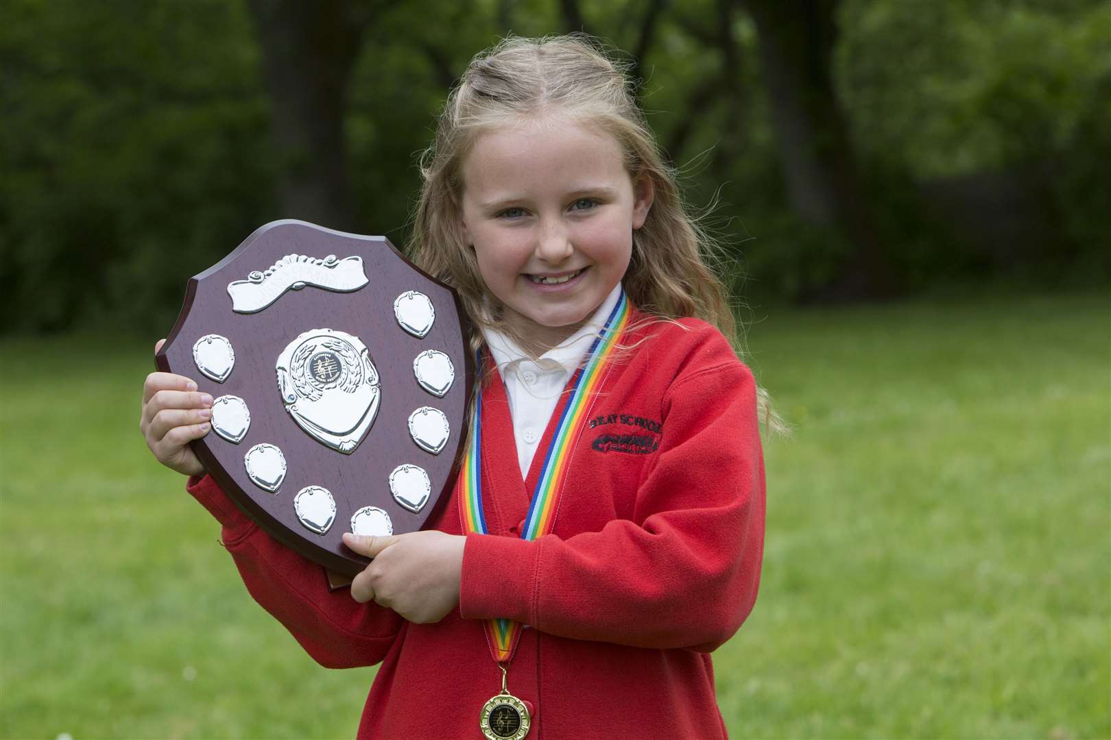 Isla Sutherland is the first winner of the Diana Curran Memorial Shield for verse speaking, P3 girls. The shield was donated by Dennis Lundie, retired head teacher of Wick North Primary School, in memory of his partner. It is one of two memorial shields donated this year by Mr Lundie. The other is in memory of his late father. Picture: Robert MacDonald / Northern Studios