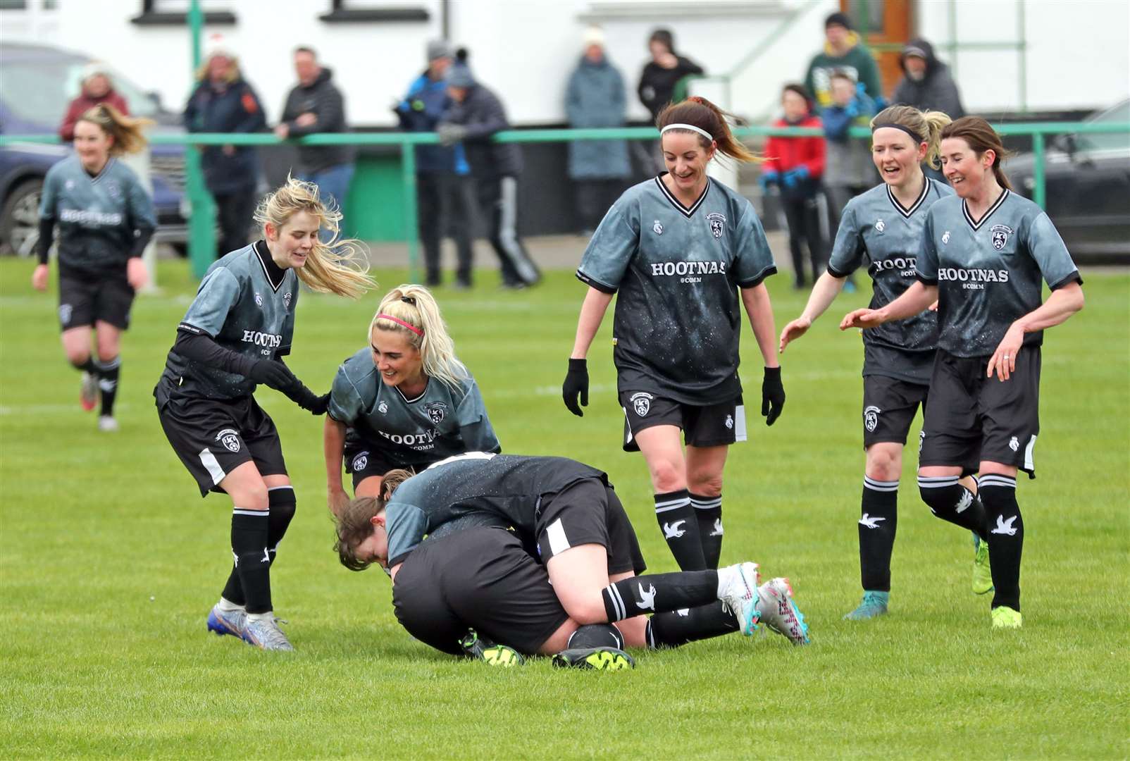 Kerrie Martin is mobbed by team-mates after scoring her first goal in Caithness Ladies' recent 5-2 victory over Ross and Cromarty in the SWF Highlands and Islands League. Picture: James Gunn
