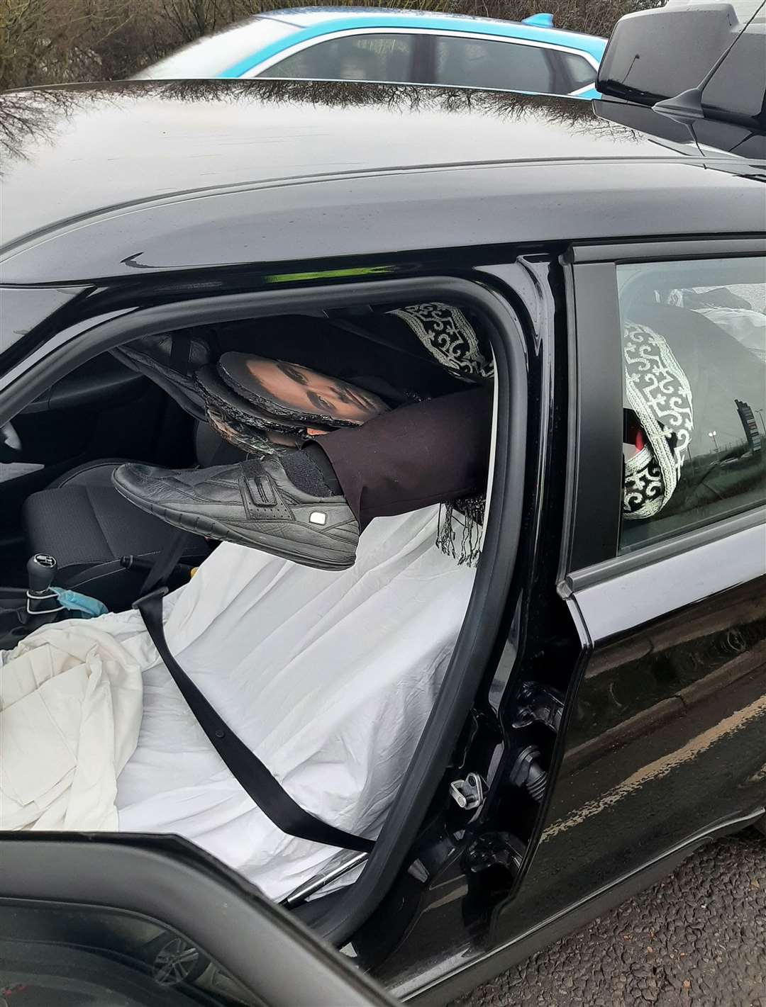 The mannequin’s feet protruding from a rolled-up carpet (Cambridgeshire Police/PA)