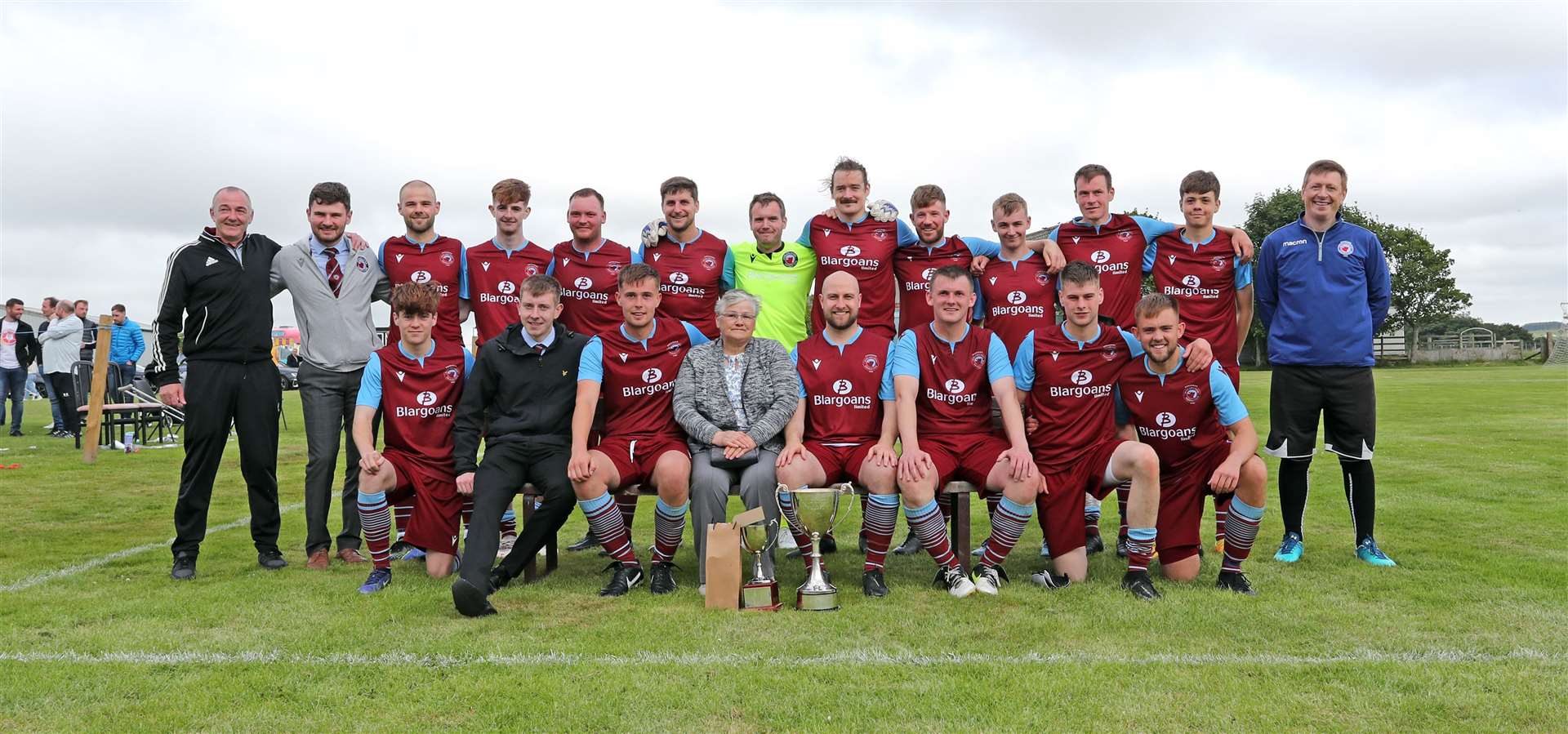 Mary Mackintosh and the victorious Pentland United team with the Eain Mackintosh Cup and the Alan (Bobo) Mackay memorial trophy for the man of the match, Andy Mackay. Picture: James Gunn