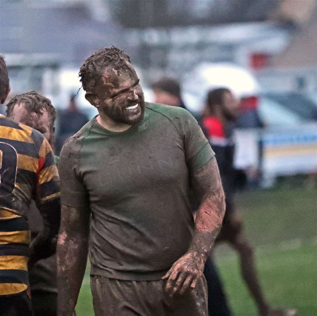 Grant Anderson of Caithness is caked in mud at the end of a hard shift against Orkney. Picture: James Gunn