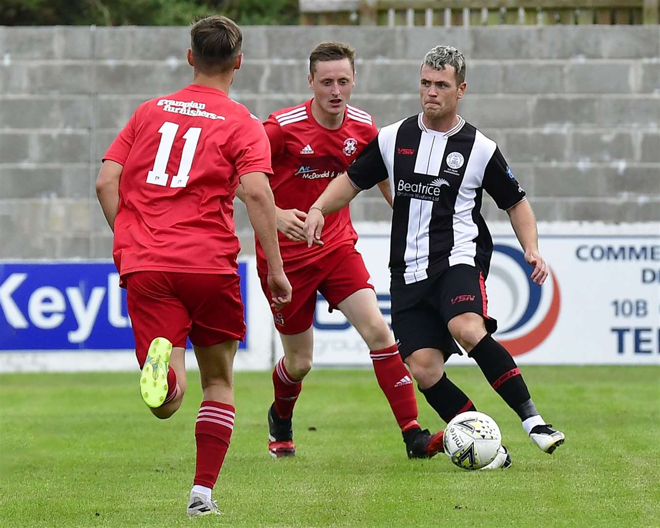 Wick Academy goalscorer Gordon MacNab looking to pick out a pass during the game at Lossiemouth. Picture: Mel Roger