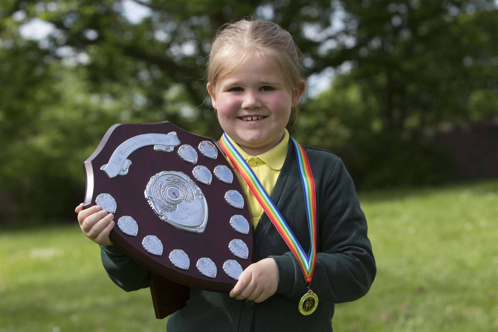 Alanna Campbell with the Maureen Allan Shield for verse speaking, girls P2. Picture: Robert MacDonald / Northern Studios