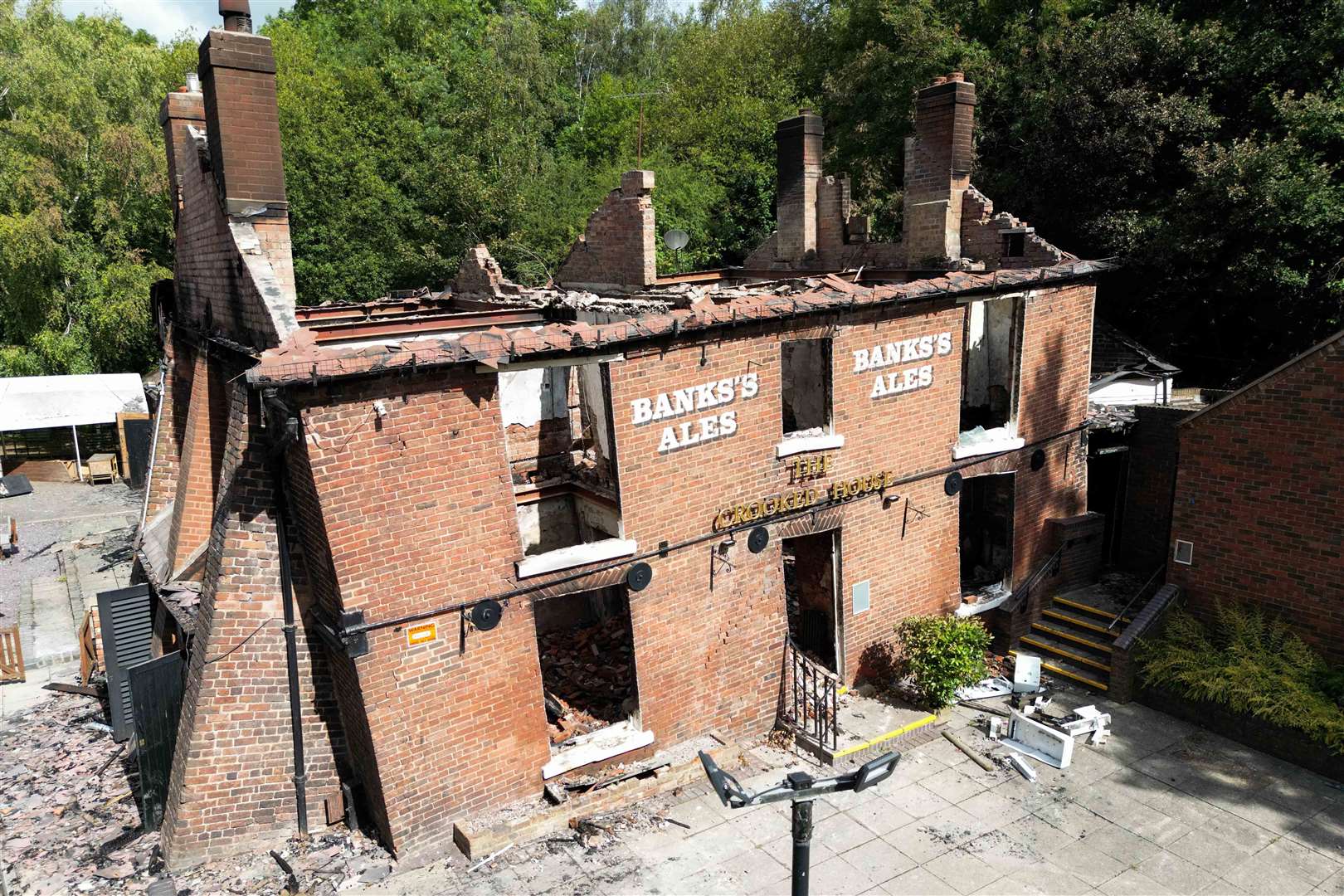 The burnt remains of The Crooked House (Jacob King/PA)