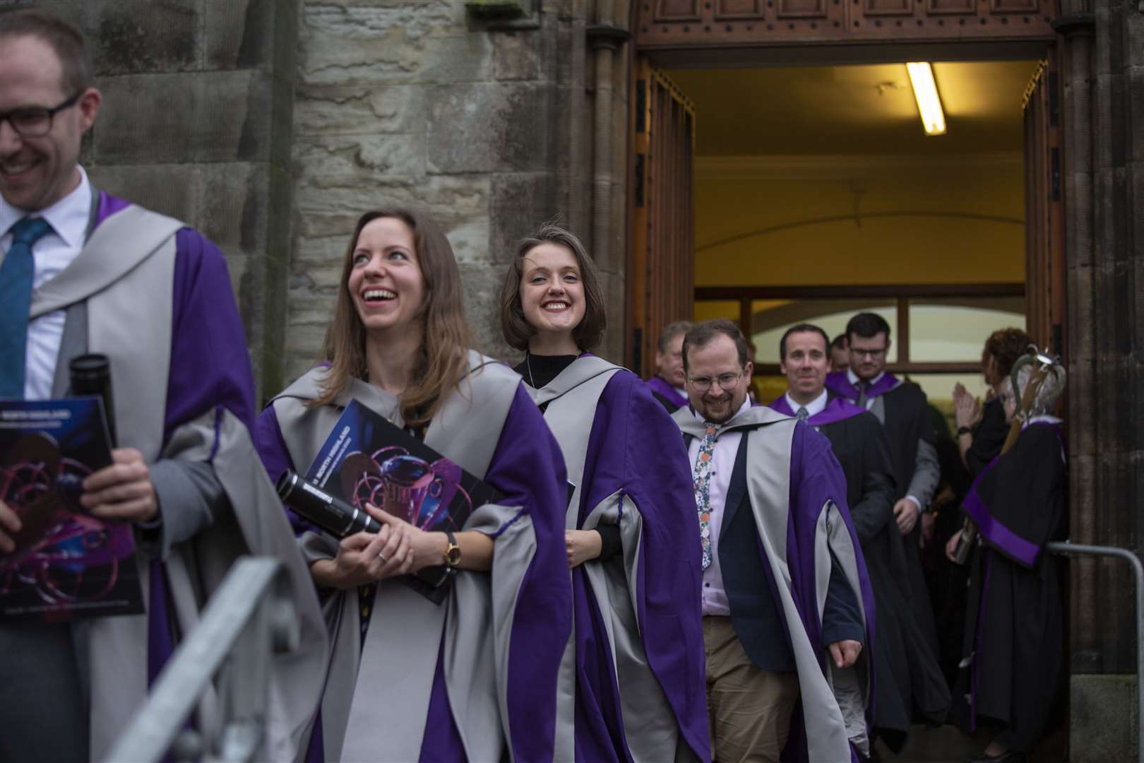 Graduates leaving the church.