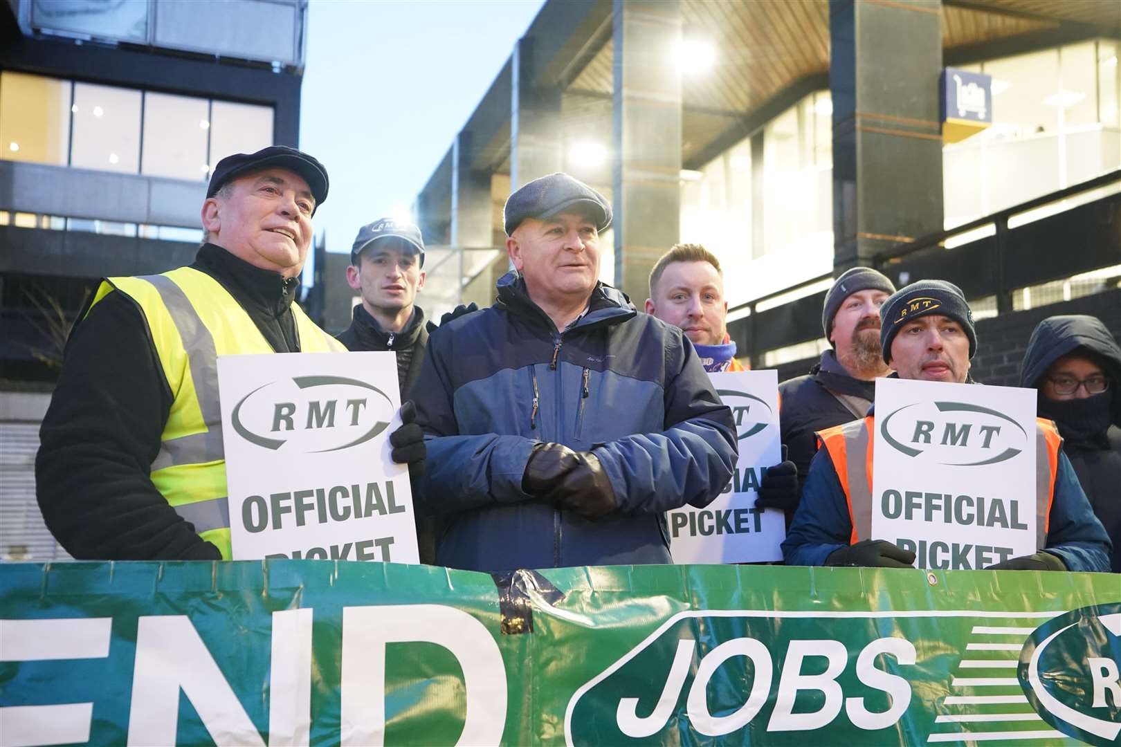 Mick Lynch (centre) joins RMT members on the picket line outside London Euston train station during a strike in a long-running dispute over jobs and pensions (James Manning/PA)