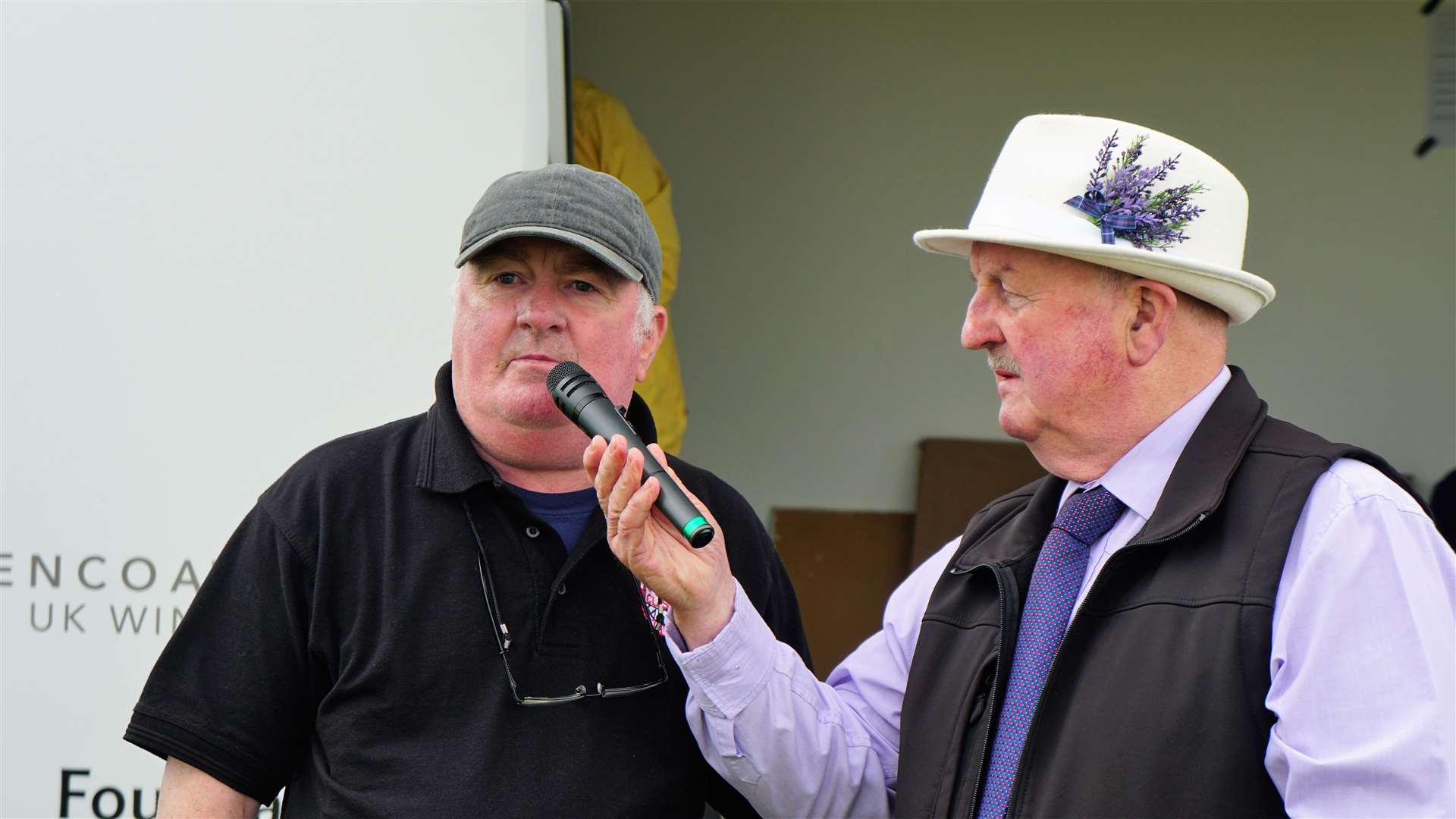 Compere at the event, Willie Mackay, hands over the mic to club chair Kevin Sutherland as the awards were about to be handed out. Picture: DGS