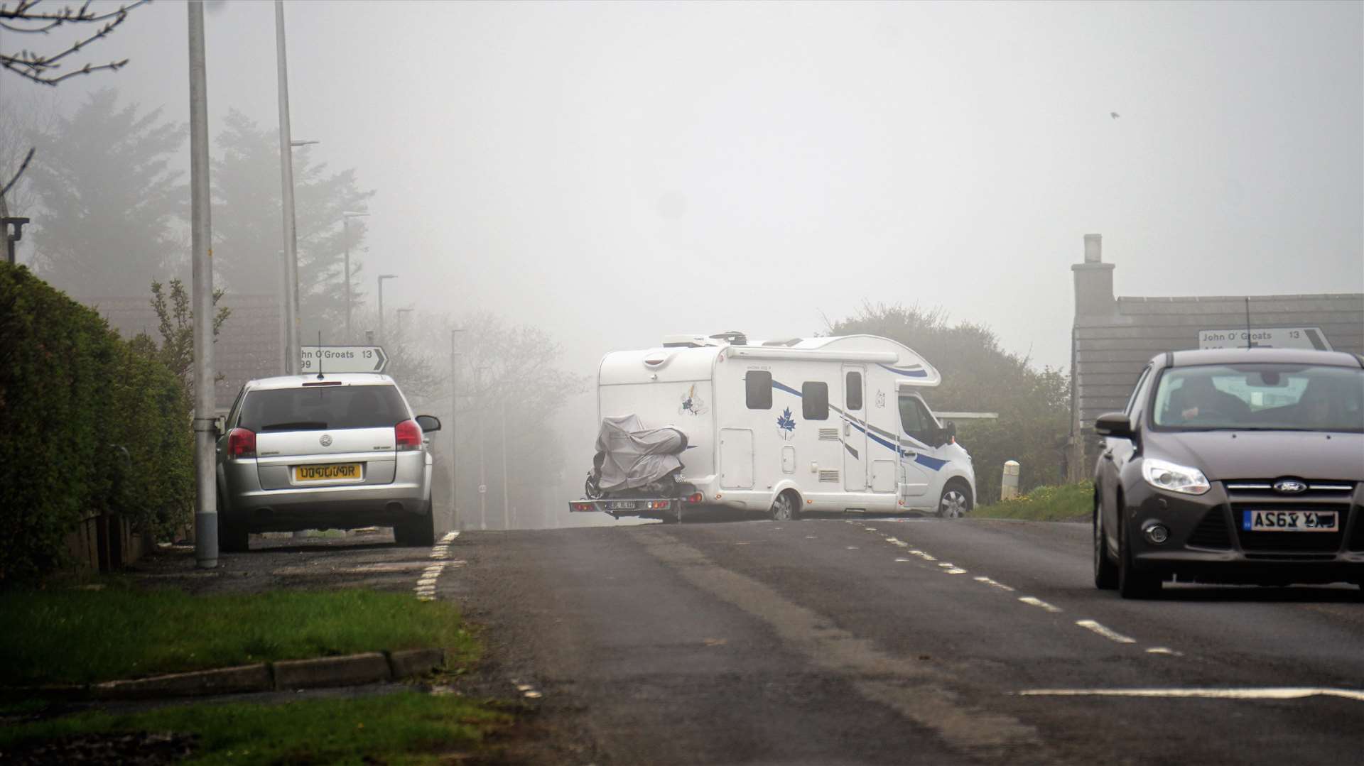A campervan seen on Wednesday afternoon making its way around the corner towards John O'Groats. Before the sign was put back up many tourists overshot the junction and manoeuvred in Nordwall Park to the consternation of residents. Picture: DGS