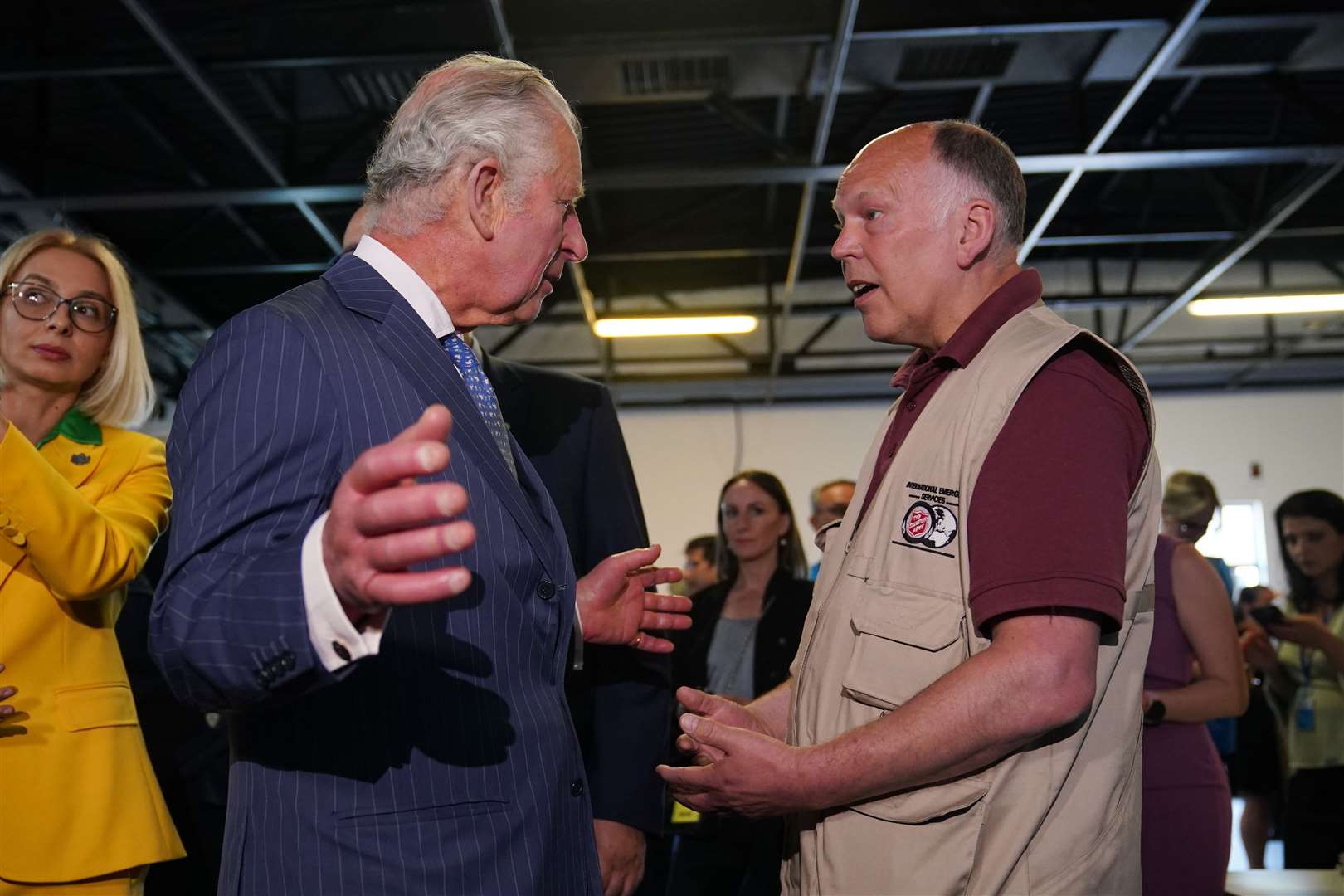 Charles meeting Salvation Army Major Stephen Noble during his visit to the distribution centre (Yui Mok/PA)