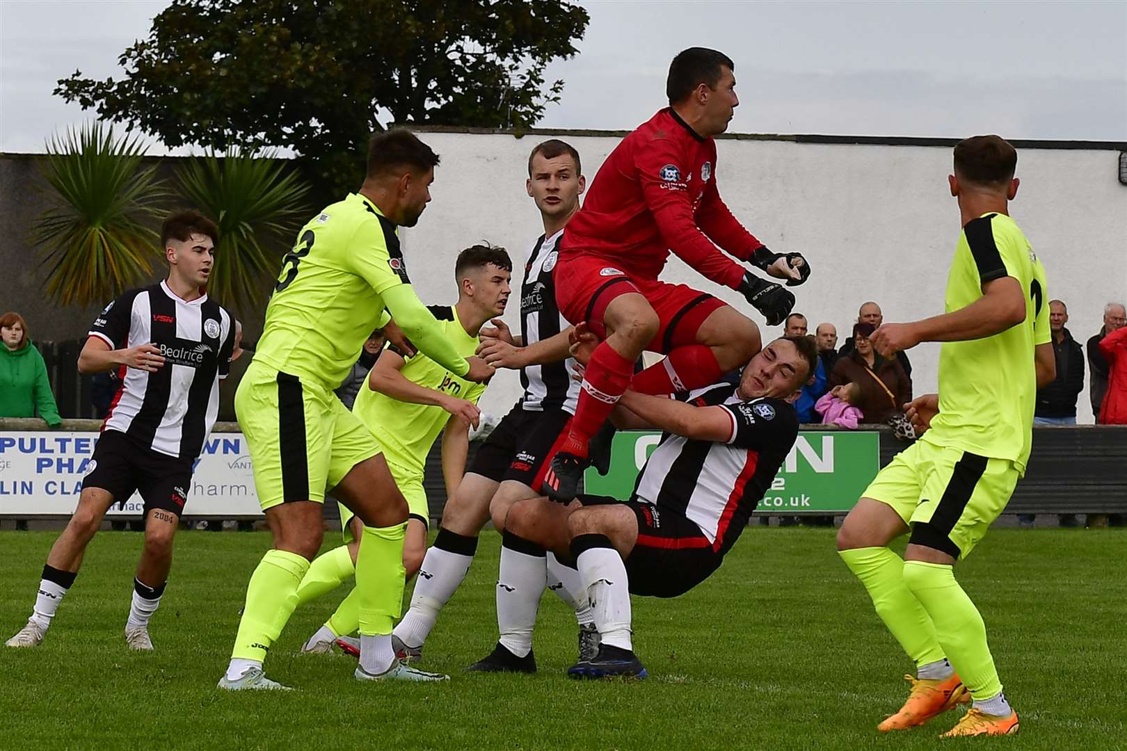 Goalkeeper Graeme Williamson collides with his Wick Academy team-mate Owen Harrold after clearing the ball. Picture: Mel Roger