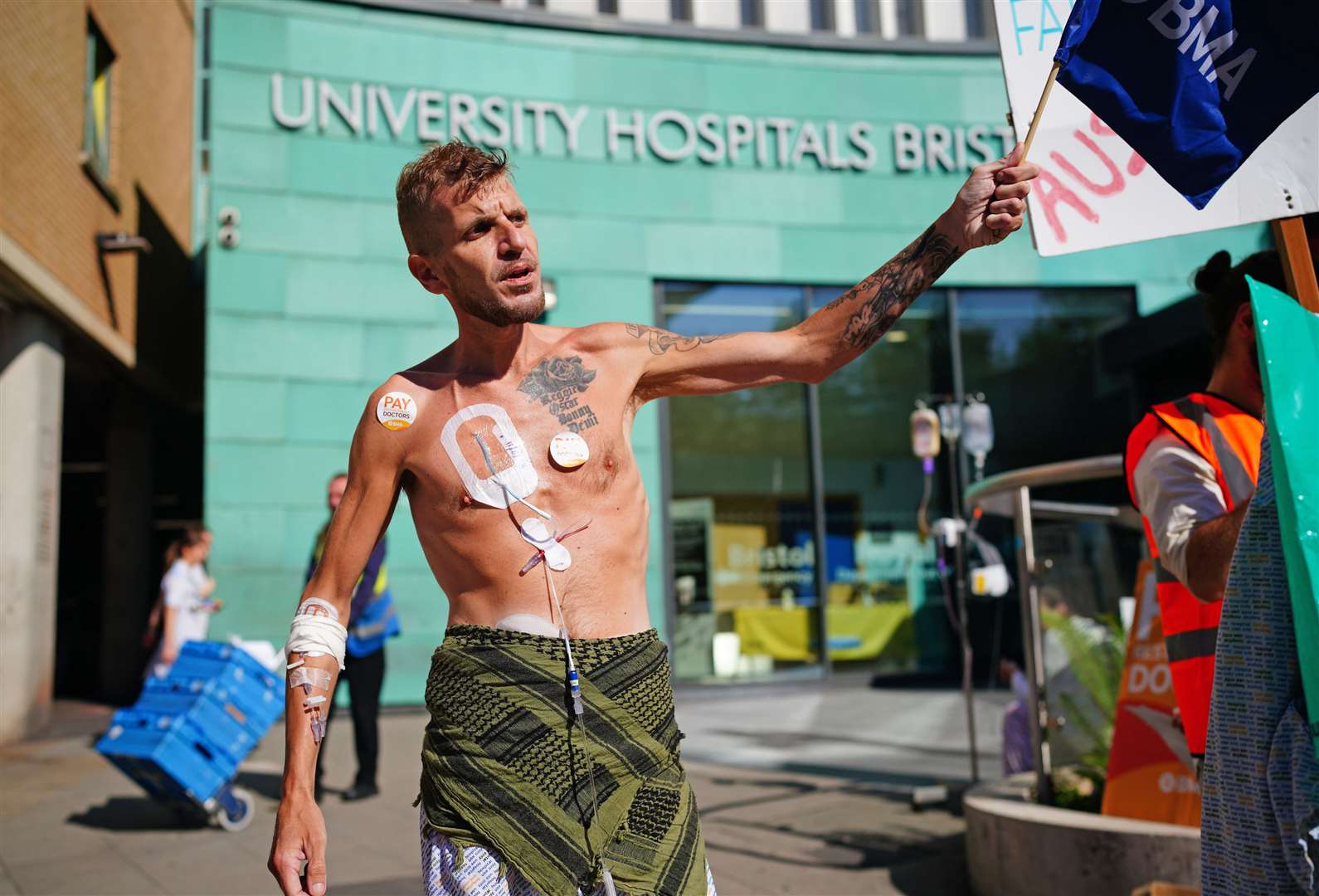 Patient Luke Rovira joining striking junior doctors from the British Medical Association on the picket line outside Bristol Royal Infirmary on Wednesday (PA)