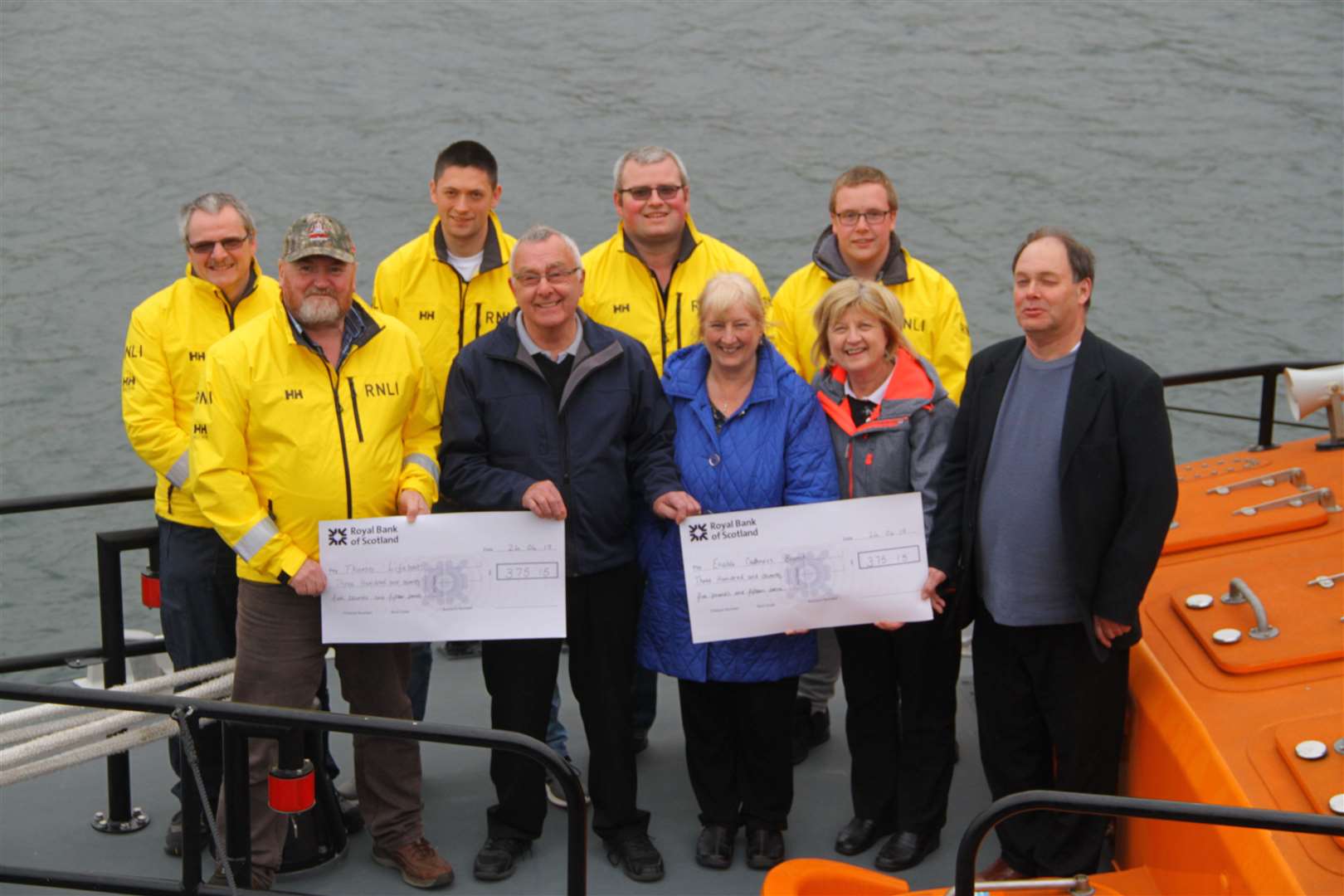 Cheques are presented to Thurso lifeboat and Enable Caithness courtesy of Hugh Campbell. Picture: Willie Mackay