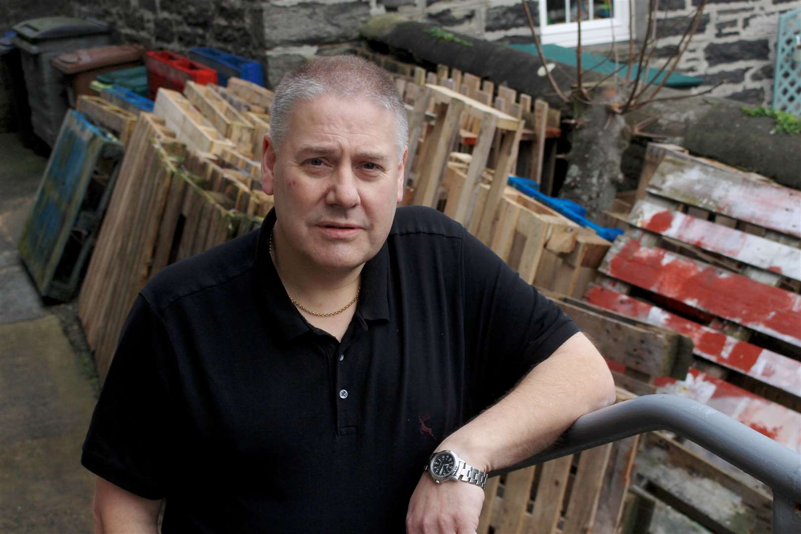A disappointed Mervyn Hill with some of the dozens of wooden pallets he had been collecting for the Bignold Park bonfire. Picture: Alan Hendry