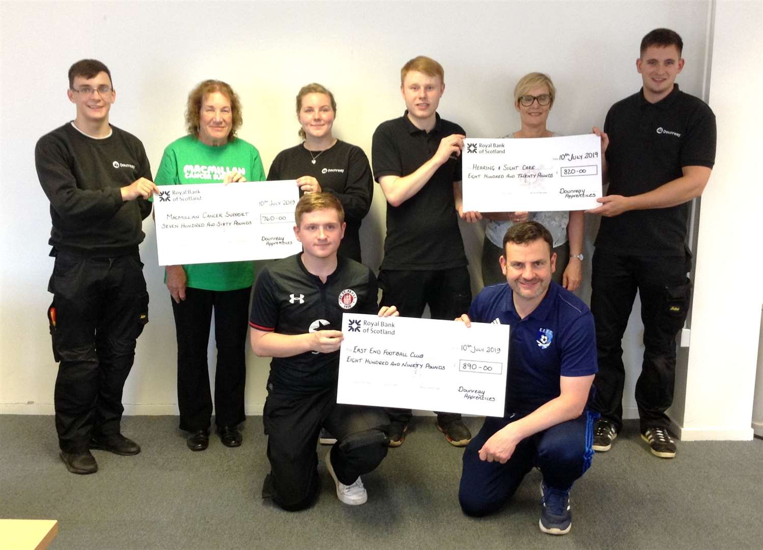 Back, from left: Adam Gunn, Frances Purves (Macmillan Cancer Support), Laura Manson, Michael Mowat, Deirdre Aitken (Hearing and Sight Care) and Sean Lewis. Front: Cameron McIntosh and Derek Shearer (East End FC).