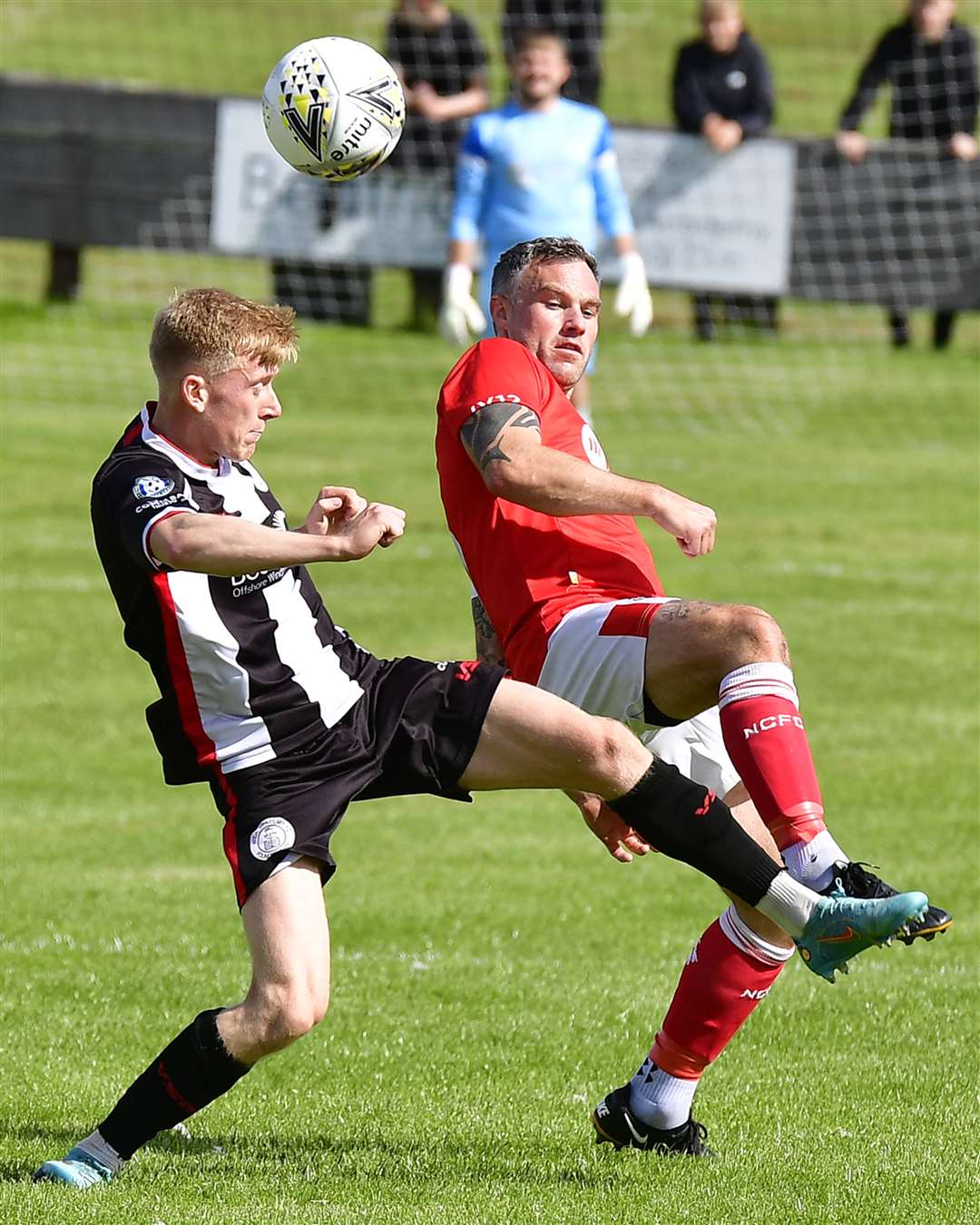 Wick Academy's Ross Gunn and Nairn County's Wayne Mackintosh. Picture: Mel Roger