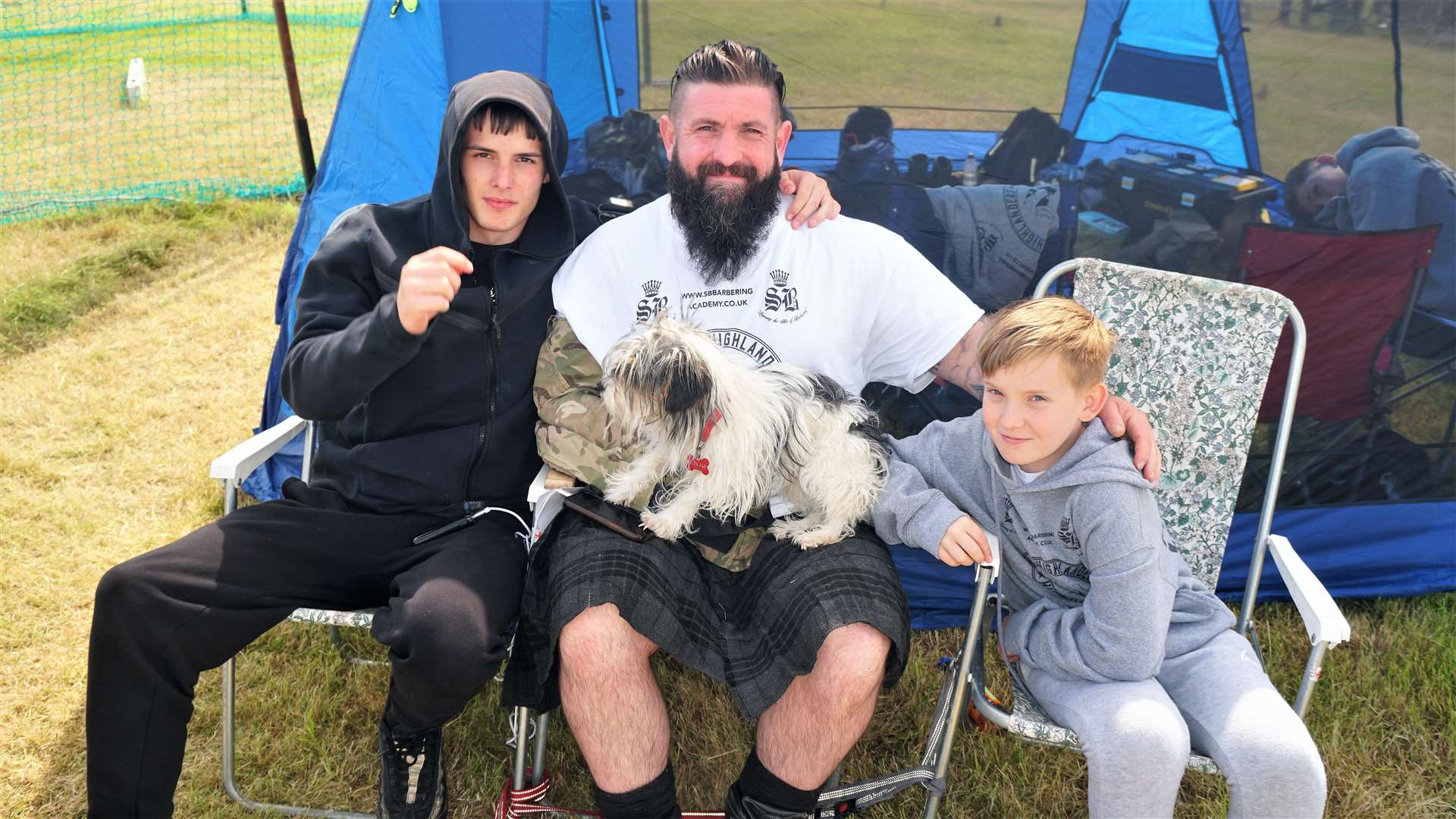Wounded Highlander athlete Mark Tonner with his sons Ethan and Joey and dog Rosie. Picture: DGS